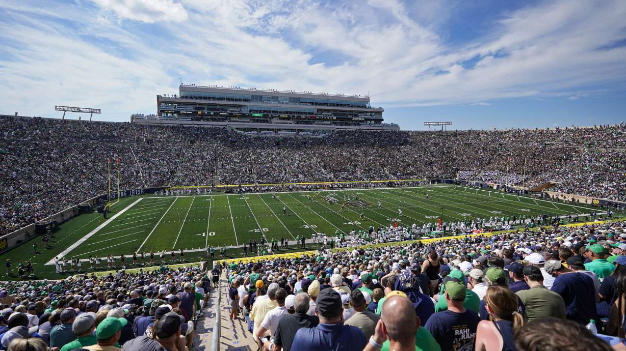 FILE -Notre Dame and Marshall play during the first half of an NCAA college football game in South Bend, Ind., Sept. 10, 2022. The athletic directors who lead the schools that play Division I college football at the highest level want the sport to continue be governed by the NCAA — if that governance can be streamlined. LEAD1, an association of Football Bowl Subdivision ADs, convened 105 of its 131 members Wednesday, Sept. 14, for a meeting that focused mostly on how best to govern major college football.