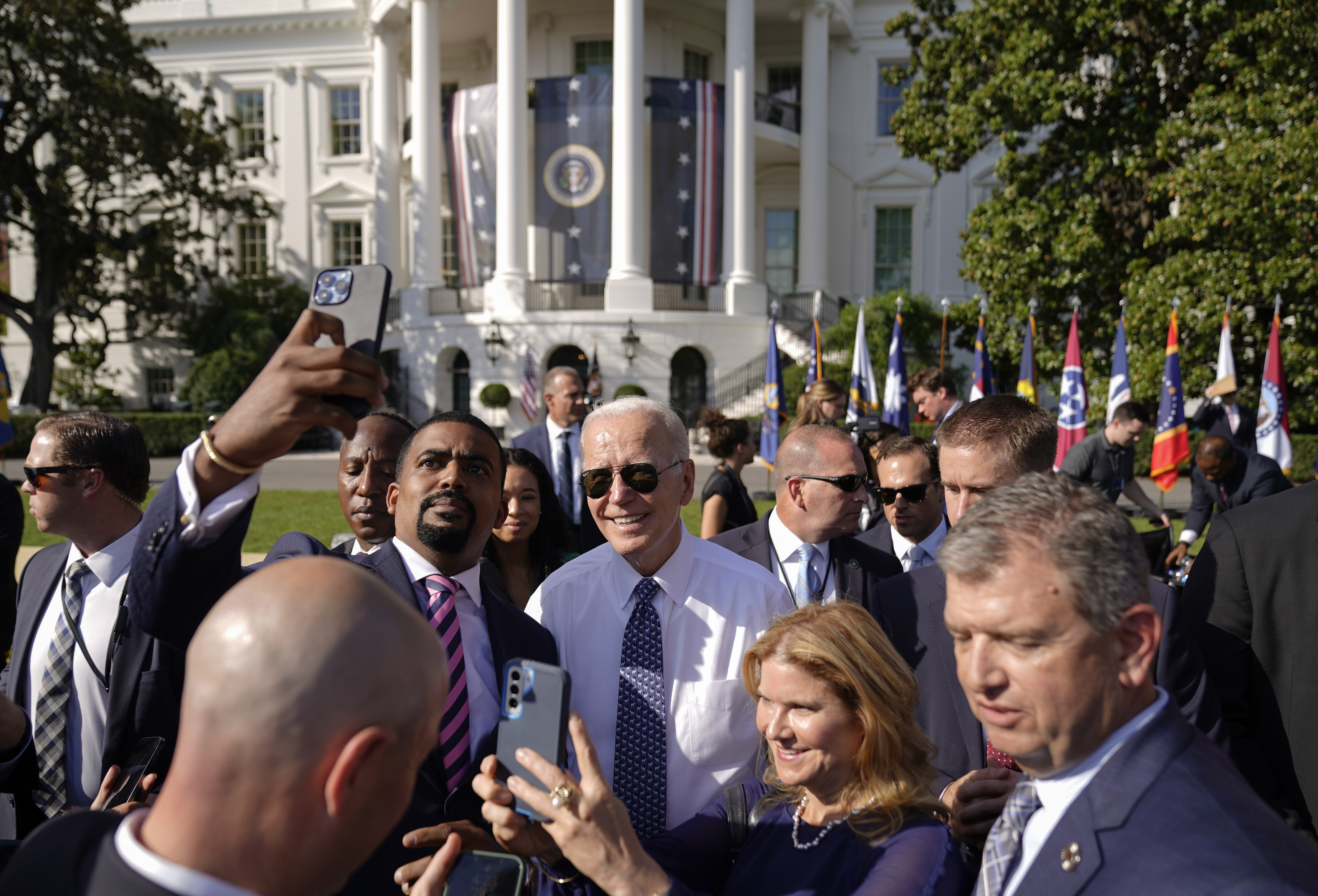 President Joe Biden poses for a photo after speaking on the south lawn of the White House in Washington, Tuesday. Biden’s popularity has improved substantially from his lowest point this summer, but concerns about his handling of the economy persist, according to a poll from the Associated Press-NORC Center for Public Affairs Research. 