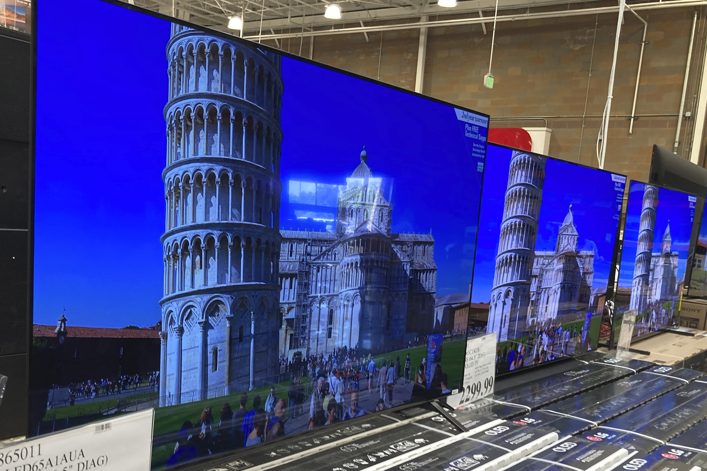 A 65-inch television is shown at a warehouse, June 17, 2021, in Lone Tree, Colo. Buy now, pay later loans allow users to pay for items such as new sneakers, electronics or luxury goods in installments.