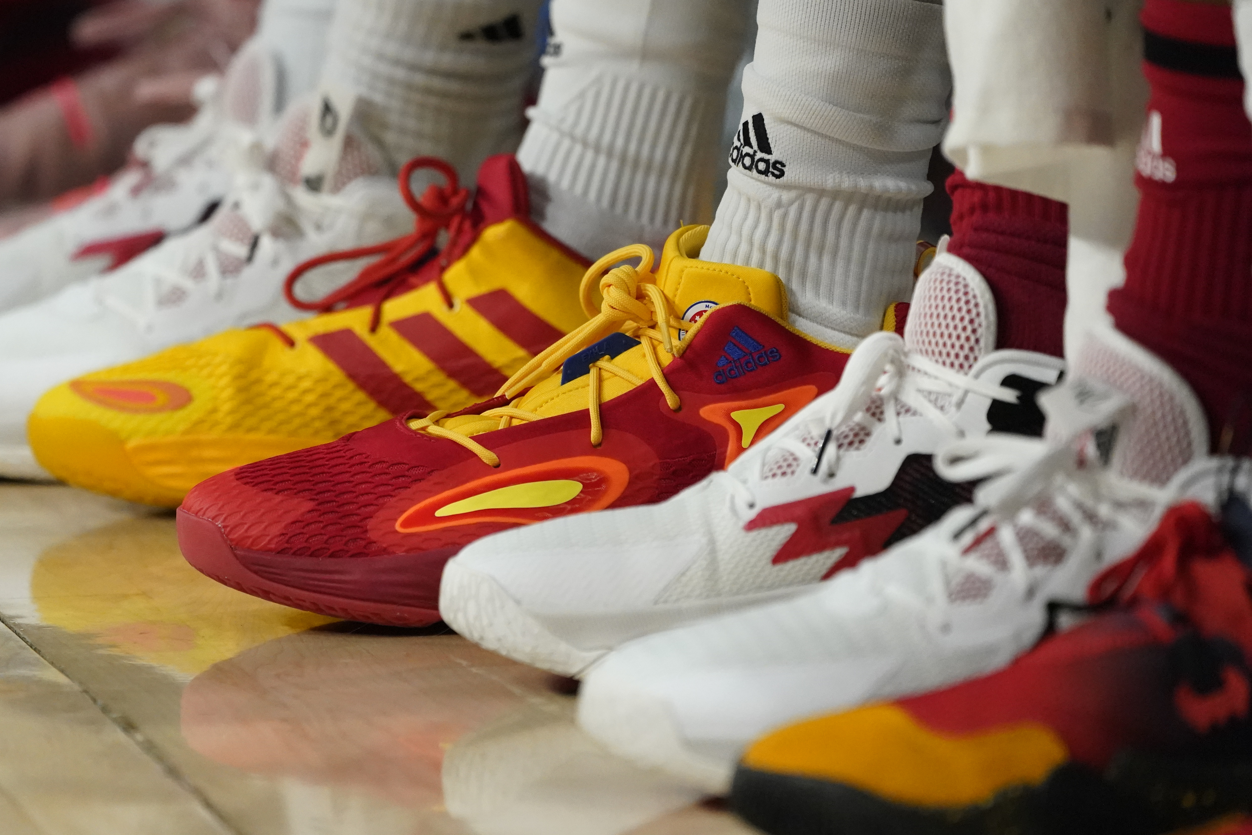 Basketball sneakers are seen at a game, March 29, in Chicago. Buy now, pay later loans allow users to pay for items such as new sneakers, electronics or luxury goods in installments.