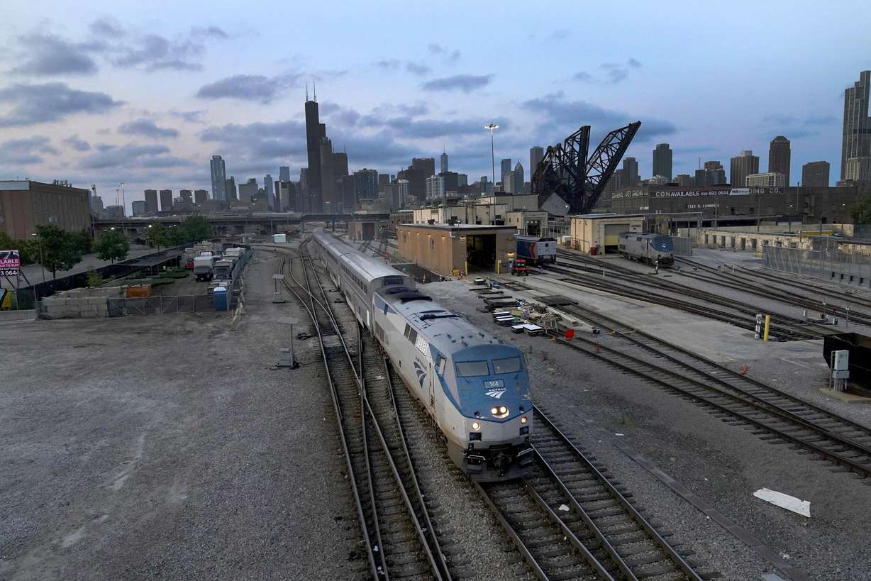 An Amtrak passenger train departs Chicago in the early evening headed south Wednesday in Chicago. President Joe Biden said Thursday that a tentative railway labor agreement has been reached, averting a potentially devastating strike before the pivotal midterm elections.