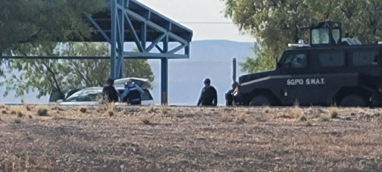 St. George Police SWAT officers surround a vehicle at the northbound Interstate 15 Port of Entry, St. George, Utah, Aug. 3. An investigation has determined that the fatal shooting of an 83-year-old man by a St. George Police officer was justified.