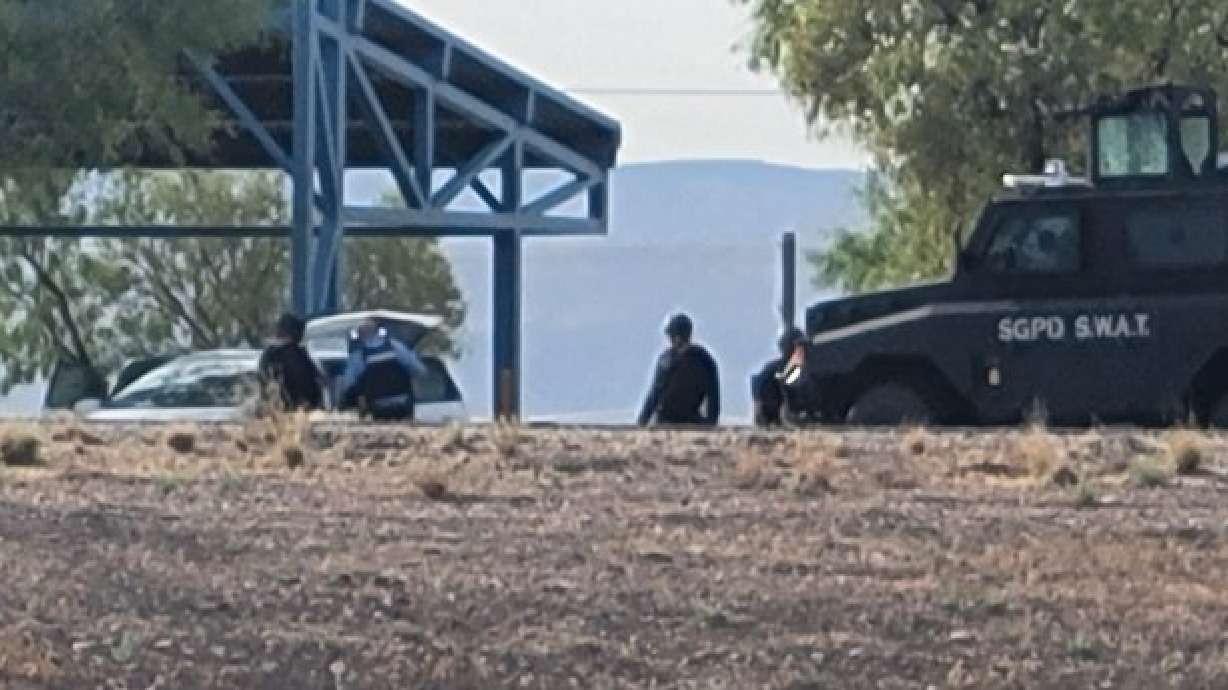 St. George Police SWAT officers surround a vehicle at the northbound Interstate 15 Port of Entry, St. George, Utah, Aug. 3. An investigation has determined that the fatal shooting of an 83-year-old man by a St. George Police officer was justified.
