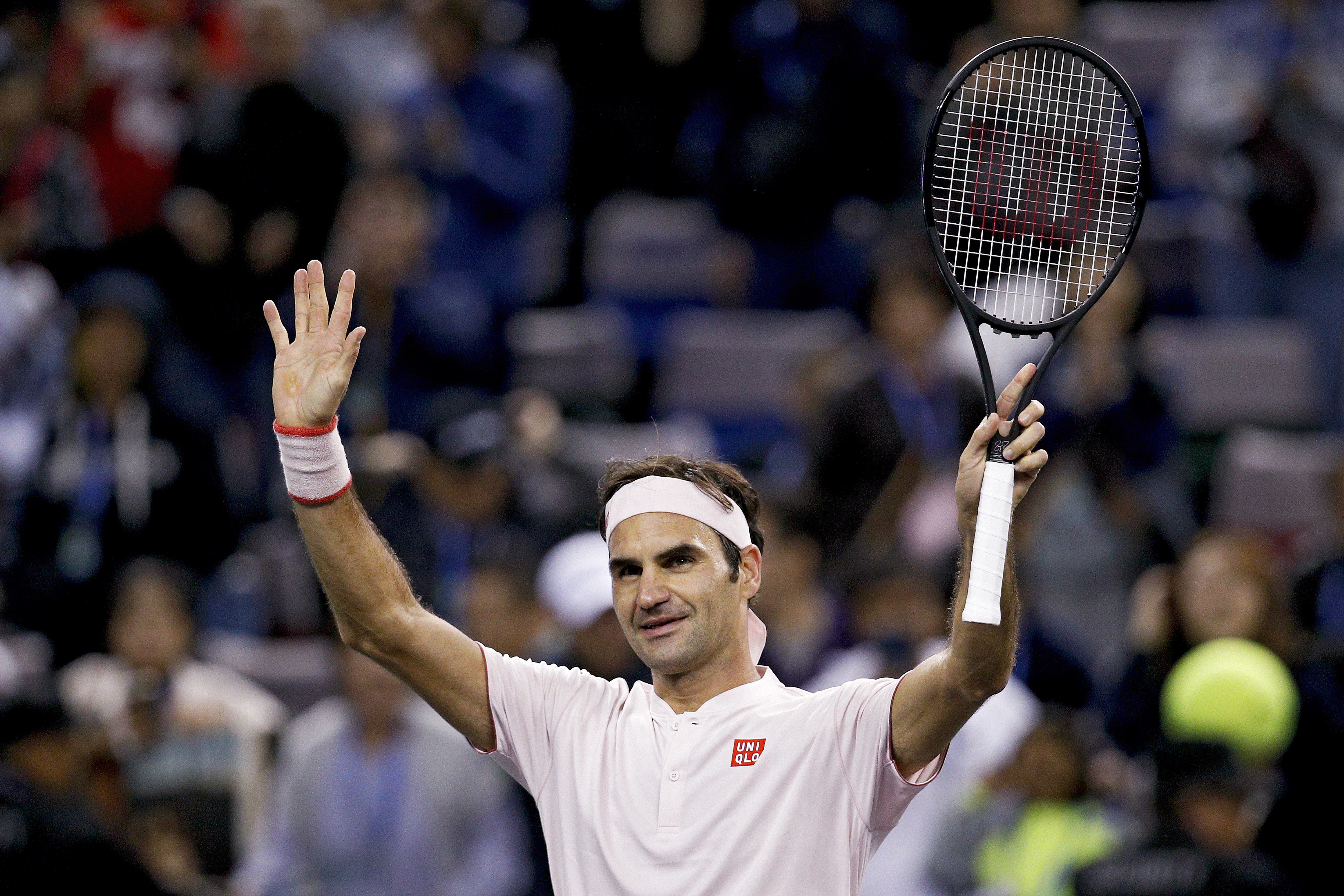 FILE - Roger Federer of Switzerland waves to spectators after defeating Daniil Medvedev of Russia in their men's singles match of the Shanghai Masters tennis tournament at Qizhong Forest Sports City Tennis Center in Shanghai, China, Oct. 10, 2018. Federer announced Thursday, Sept. 15, 2022 he is retiring from tennis. 