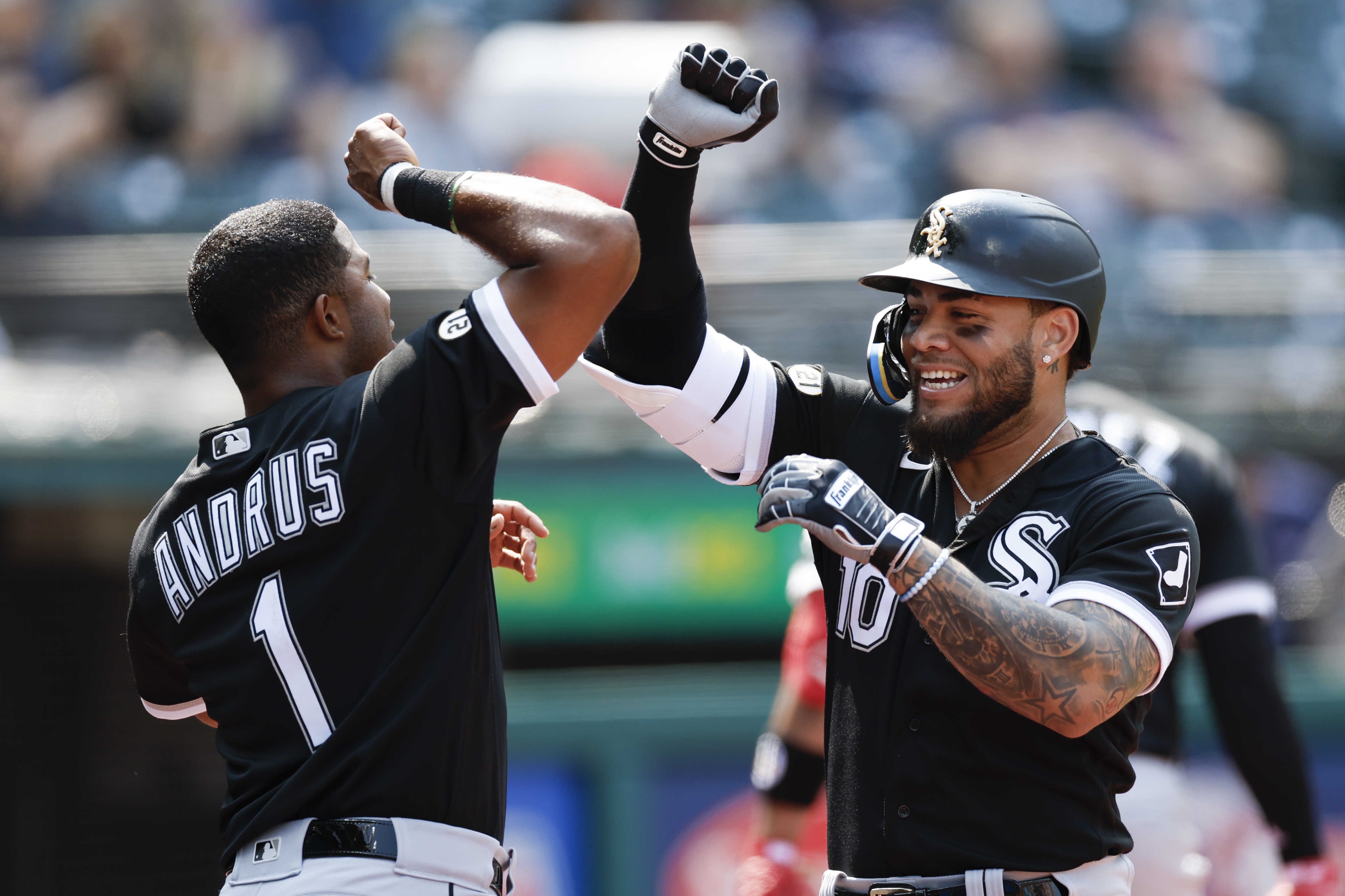 Chicago White Sox's Yoan Moncada (10) celebrates with Elvis Andrus after hitting a solo home run off Cleveland Guardians starting pitcher Hunter Gaddis during the third inning of a baseball game, Thursday, Sept. 15, 2022, in Cleveland.