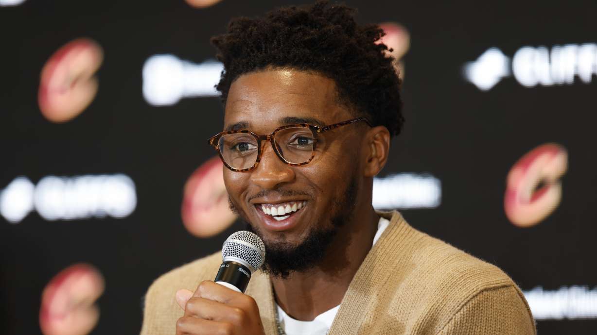 Cleveland Cavaliers guard Donovan Mitchell answers a question during an NBA basketball news conference, Wednesday, Sept. 14, 2022, in Cleveland.