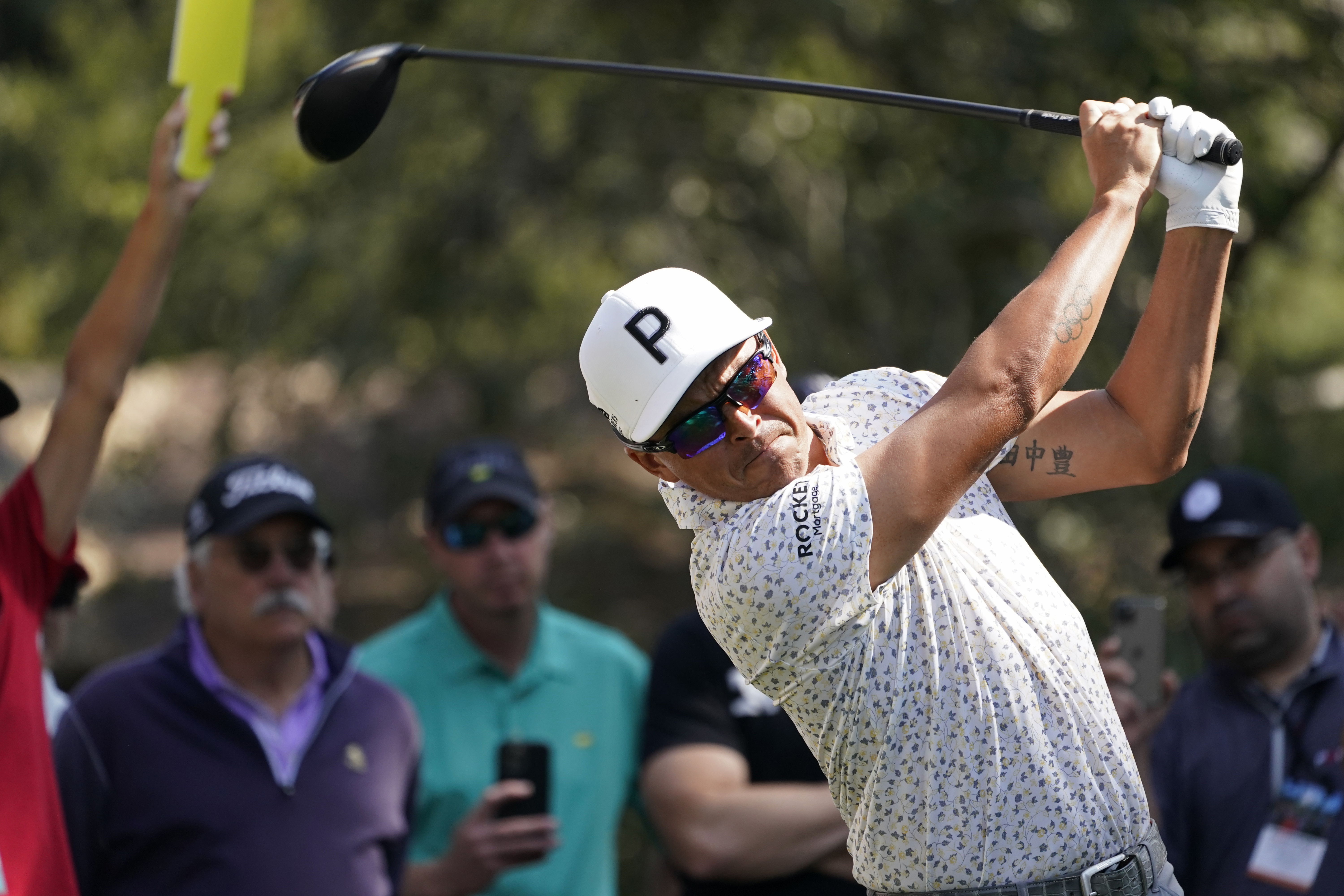 Rickie Fowler follows his drive from the 18th tee of the Silverado Resort North Course during the first round of the Fortinet Championship PGA golf tournament in Napa, Calif., Thursday, Sept. 15, 2022. 