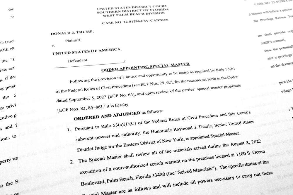 Pages from the order by U.S. District Judge Aileen Cannon naming Raymond Dearie as special master to serve as an independent arbiter and to review records seized during the FBI search of former President Donald Trump's Mar-a-Lago estate, are photographed Thursday.
