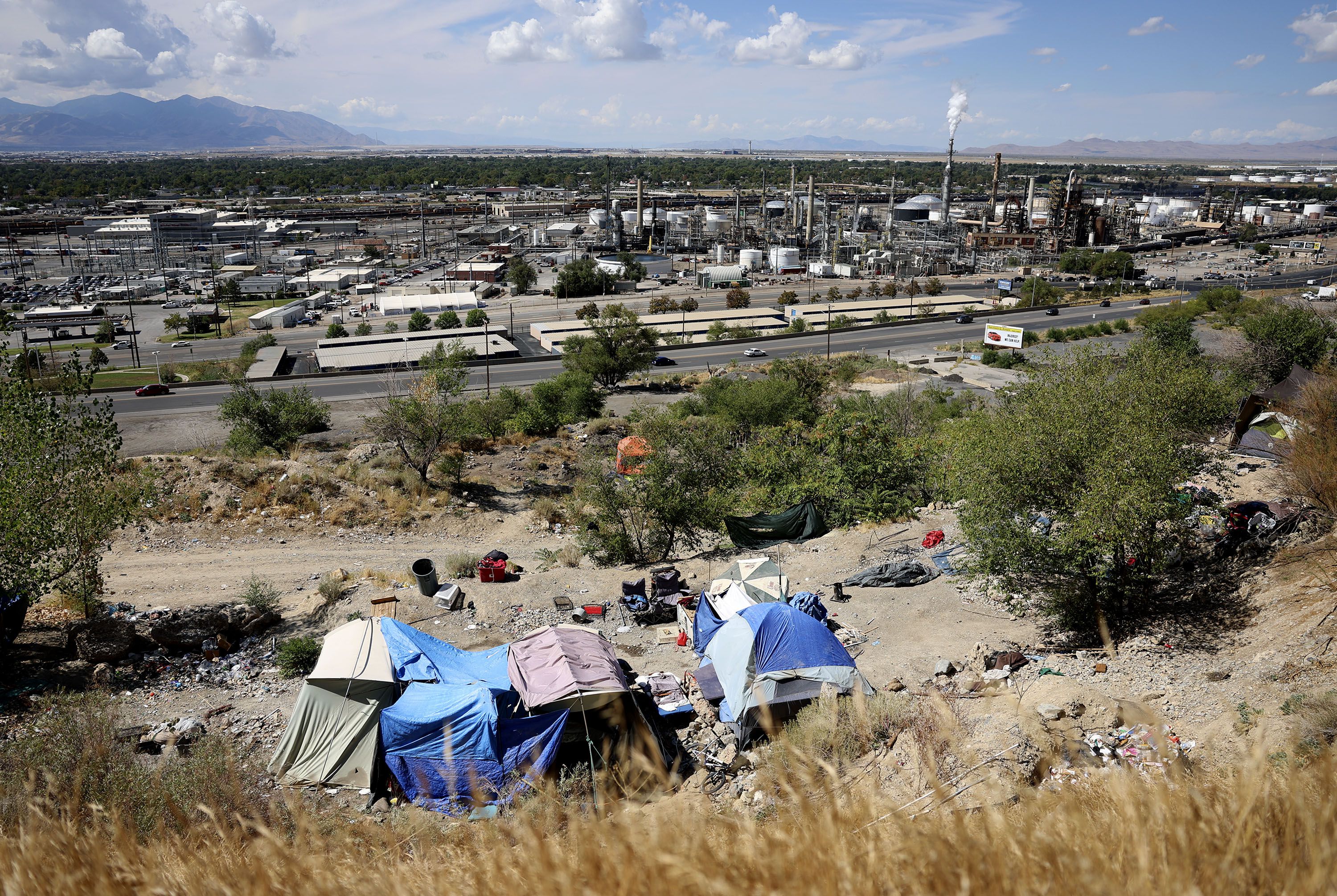 Homeless camps overlook Victory Road in Salt Lake City on Thursday.