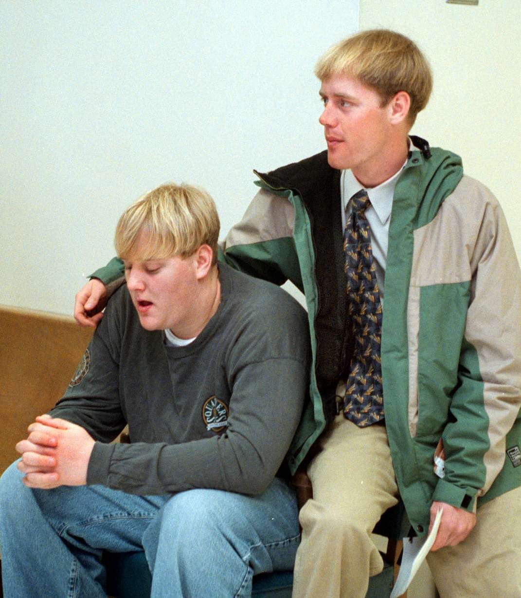 Zach Snarr's brothers, Levi, 17, (left) and Trent, 23 wait outside courtroom for sentencing of Jorge Benvenuto in 1996.