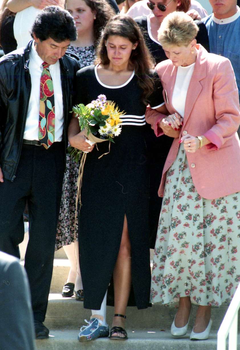 An injured Yvette Rodier is helped down a flight of stairs after the funeral of her friend Zach Snarr, who was shot and killed on Aug 28, 1996, at Little Dell Reservoir.