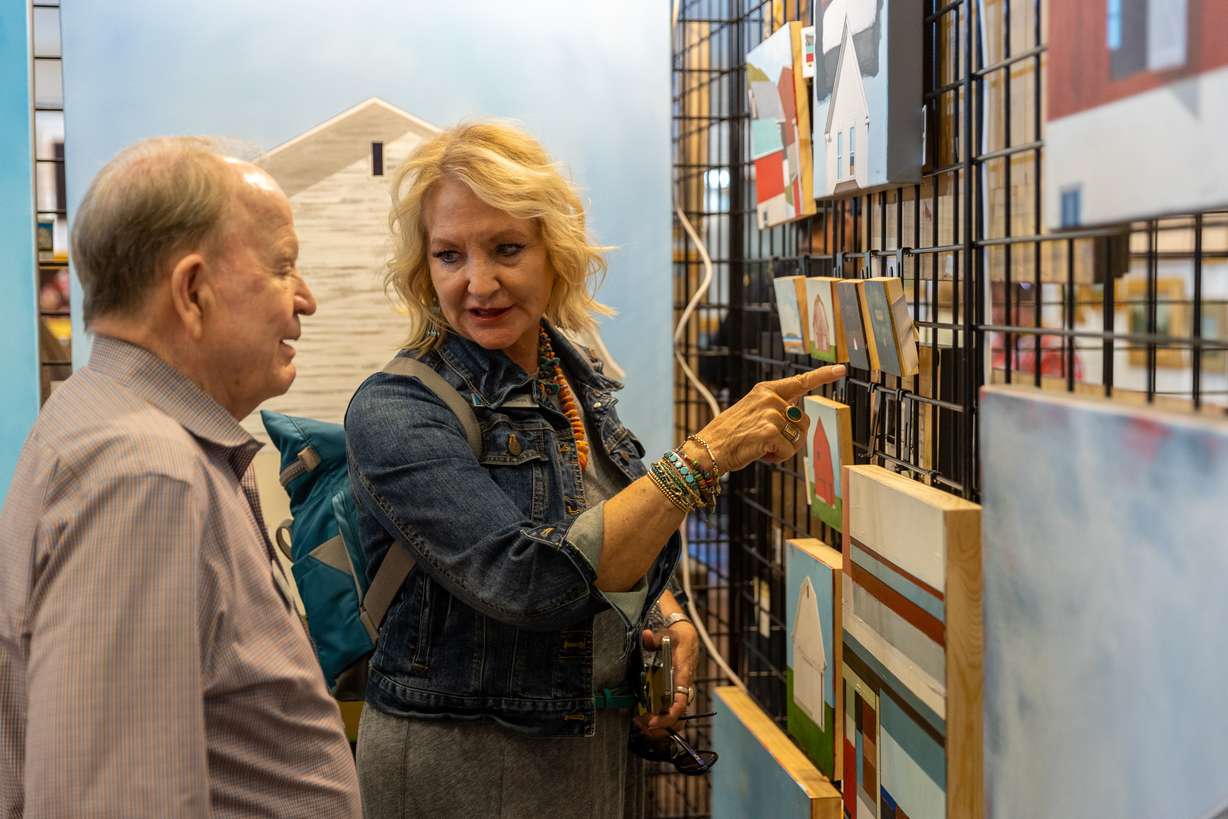 Ellis Ivory, right, CEO of the This is The Place Foundation, talks with Tresha Kramer, the foundation's director of public relations, as they view work during Art at The Park at This Is The Place Heritage Park in Salt Lake City on Friday.