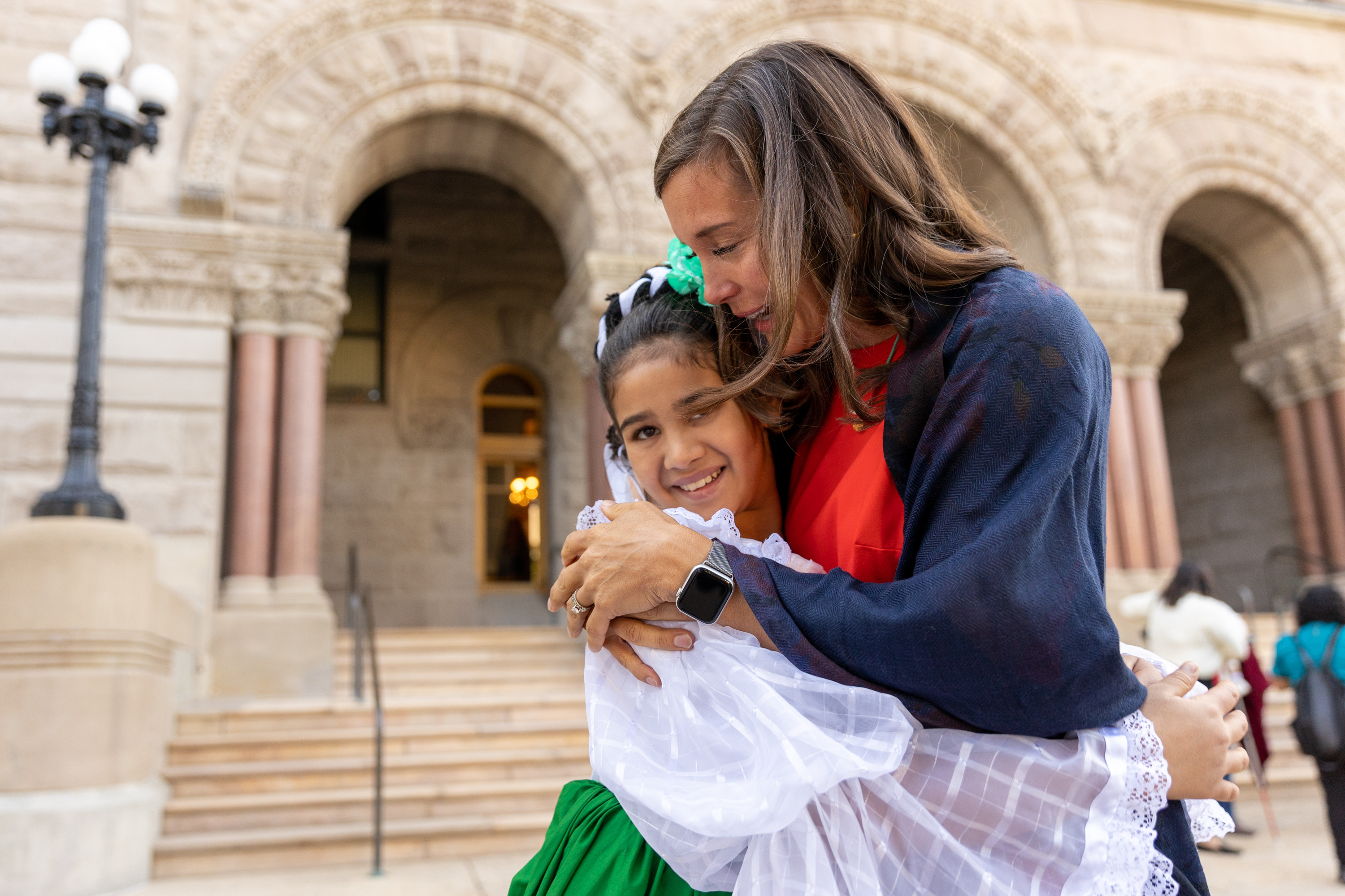 Amilia Silos, 12, of Ballet Folklórico Eck, left, gets a hug from Salt Lake City Mayor Erin Mendenhall, after Amilia performed at an event marking the start of Hispanic Heritage Month at the City-County Building in Salt Lake City on Friday.