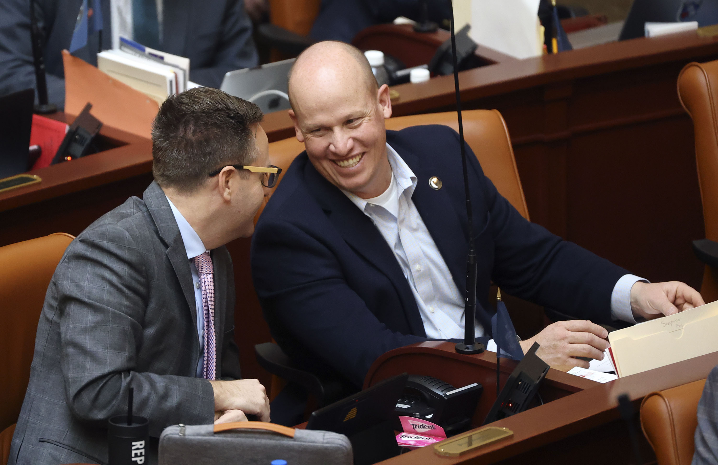 Rep. Brady Brammer, R-Highland, and Rep. Joel Ferry, R-Brigham City, talk during the fourth day of the Utah general legislative session in the House chamber at the Capitol in Salt Lake City on Jan. 21. A federal judge recently denied the Utah Democratic Party's request for a preliminary injunction to force Ferry's name to be removed from the legislative race ahead of November's election, while the case makes it way through the court.