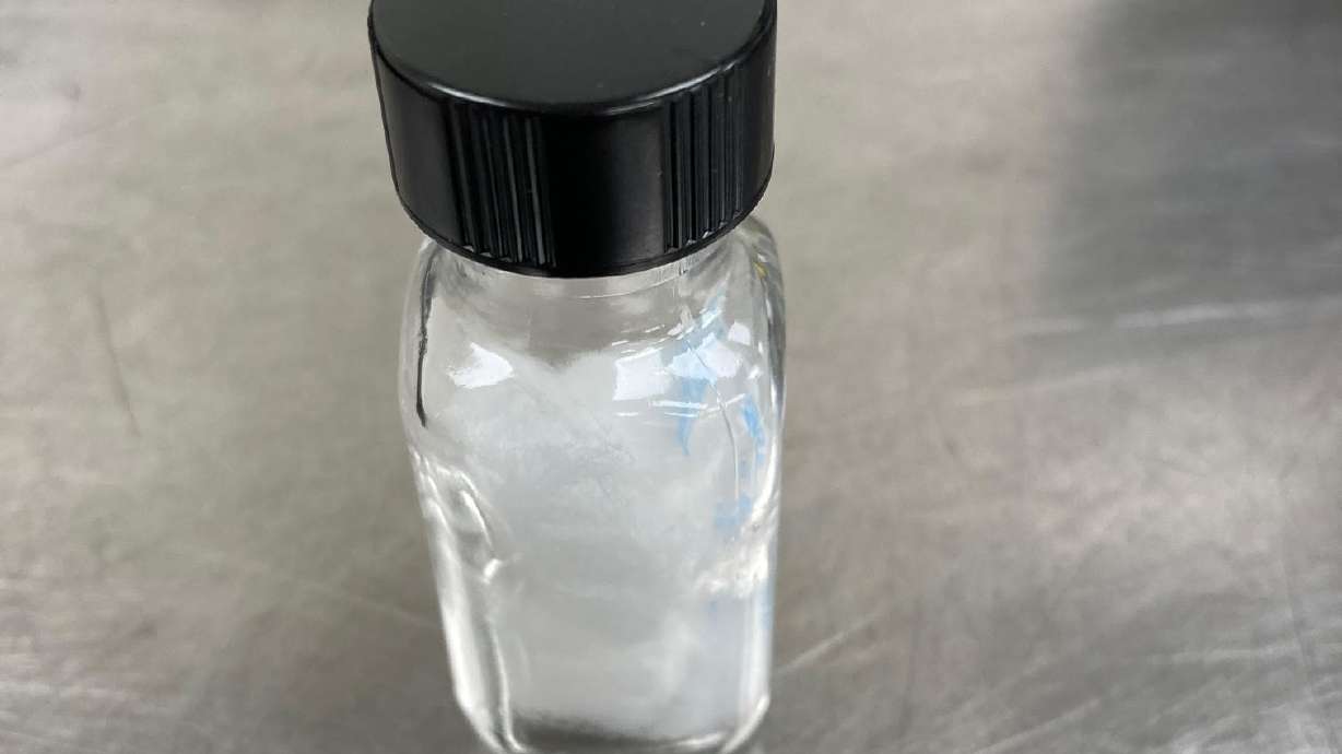 A bottle of multiple doses of radioactive iodine with a pill containing one dose. Radioactive iodine is used to treat thyroid cancers and diseases.
