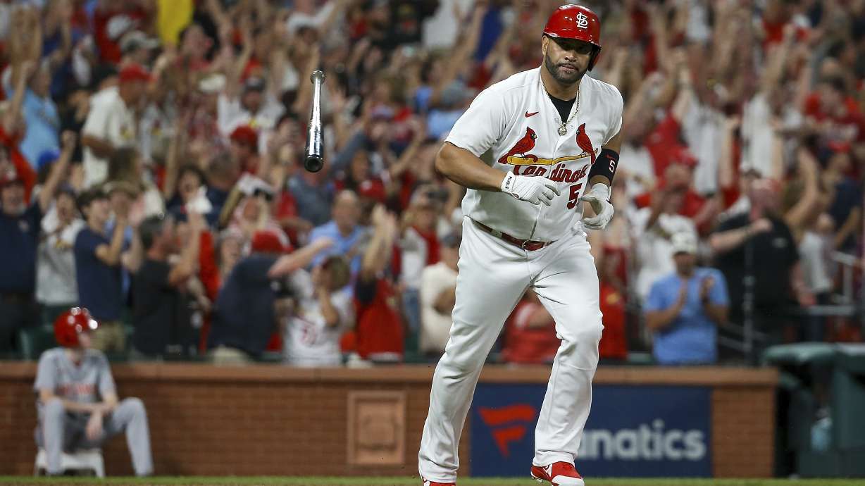 St. Louis Cardinals' Albert Pujols tosses his bat after hitting a two-run home run during the sixth inning of the team's baseball game against the Cincinnati Reds on Friday, Sept. 16, 2022, in St. Louis.