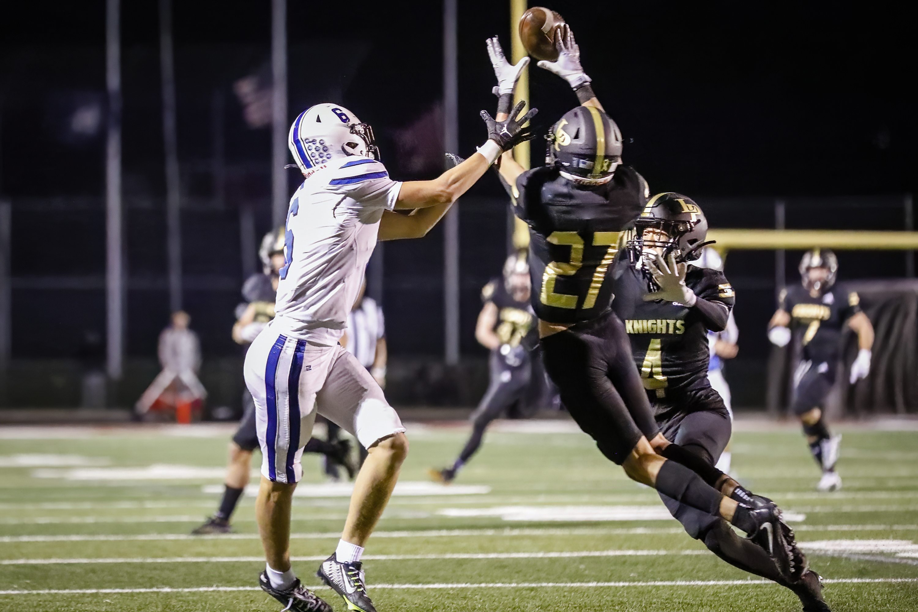 Lone Peak’s Ryder Christensen (27) intercepts a pass intended for Pleasant Grove’s Makai Peterson (6) to end Pleasant Grove’s comeback as Lone Peak hosts Pleasant Grove in Highland, Utah on Friday, Sept. 16, 2022