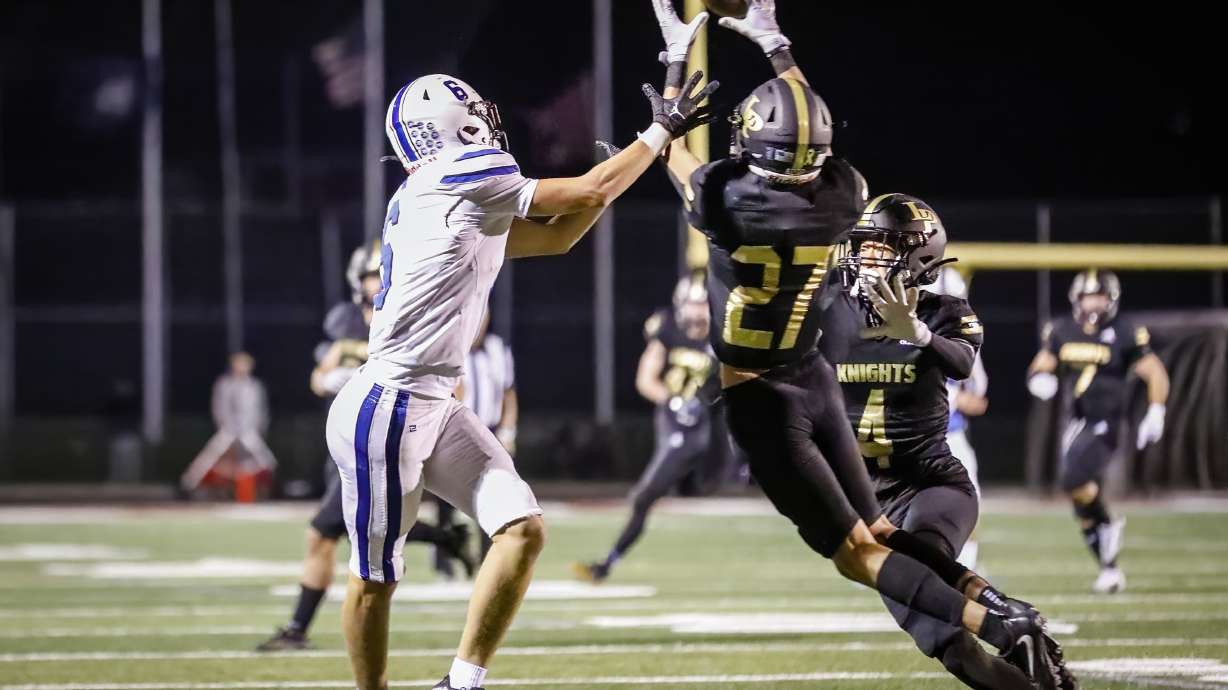 Lone Peak’s Ryder Christensen (27) intercepts a pass intended for Pleasant Grove’s Makai Peterson (6) to end Pleasant Grove’s comeback as Lone Peak hosts Pleasant Grove in Highland, Utah on Friday, Sept. 16, 2022
