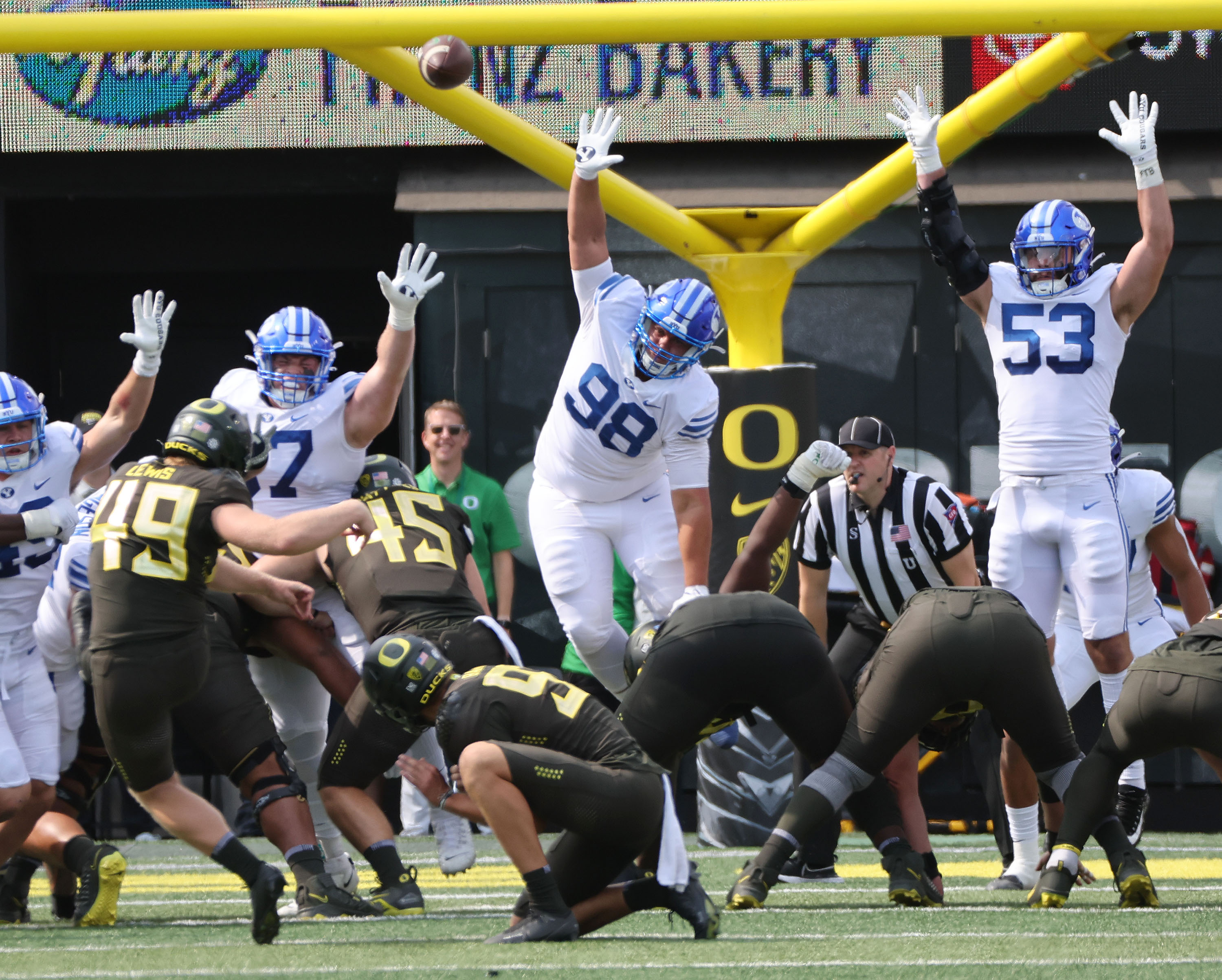Brigham Young Cougars defenders try to block an extra point  at Autzen Stadium in Eugene on Saturday, Sept. 17, 2022.