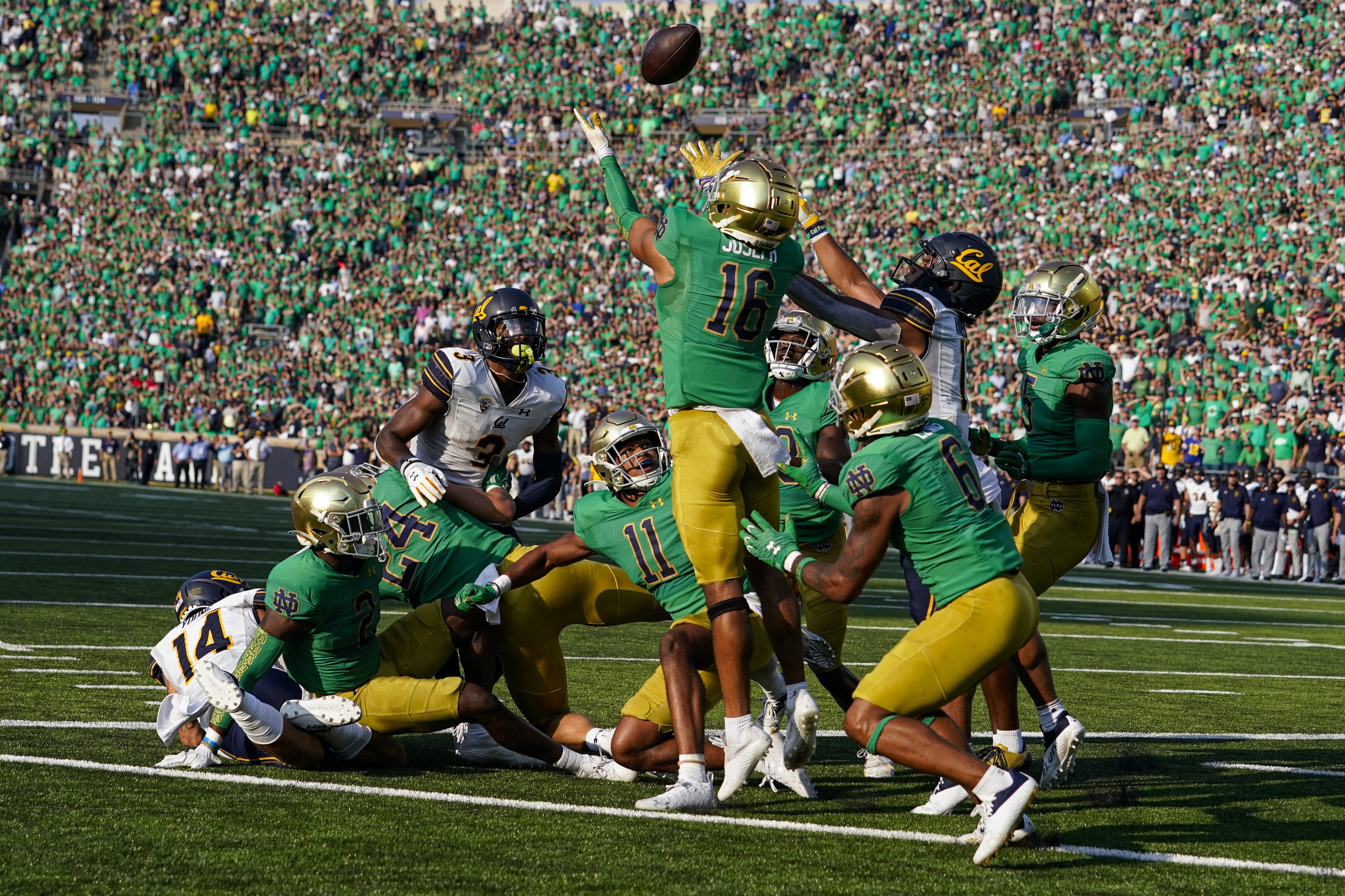 Notre Dame safety Brandon Joseph and California wide receiver Mavin Anderson (11) leap for a tipped ball as time expired in the second half of an NCAA college football game in South Bend, Ind., Saturday, Sept. 17, 2022. The pass was incomplete. Notre Dame defeated California 24-17.