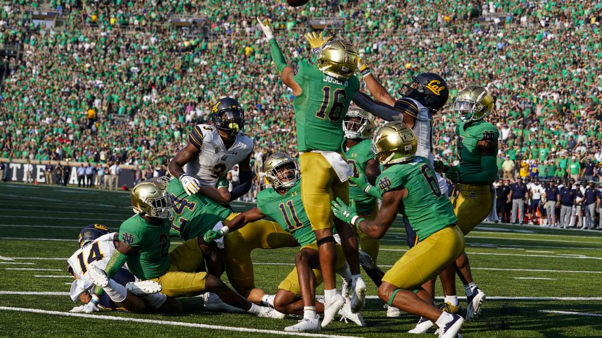 Notre Dame safety Brandon Joseph and California wide receiver Mavin Anderson (11) leap for a tipped ball as time expired in the second half of an NCAA college football game in South Bend, Ind., Saturday, Sept. 17, 2022. The pass was incomplete. Notre Dame defeated California 24-17.