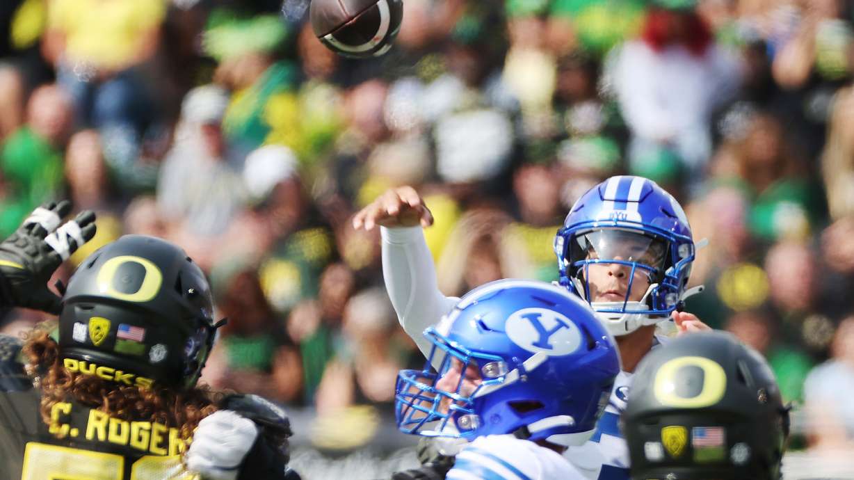 Brigham Young Cougars quarterback Jaren Hall (3) throws at Autzen Stadium in Eugene on Saturday, Sept. 17, 2022.