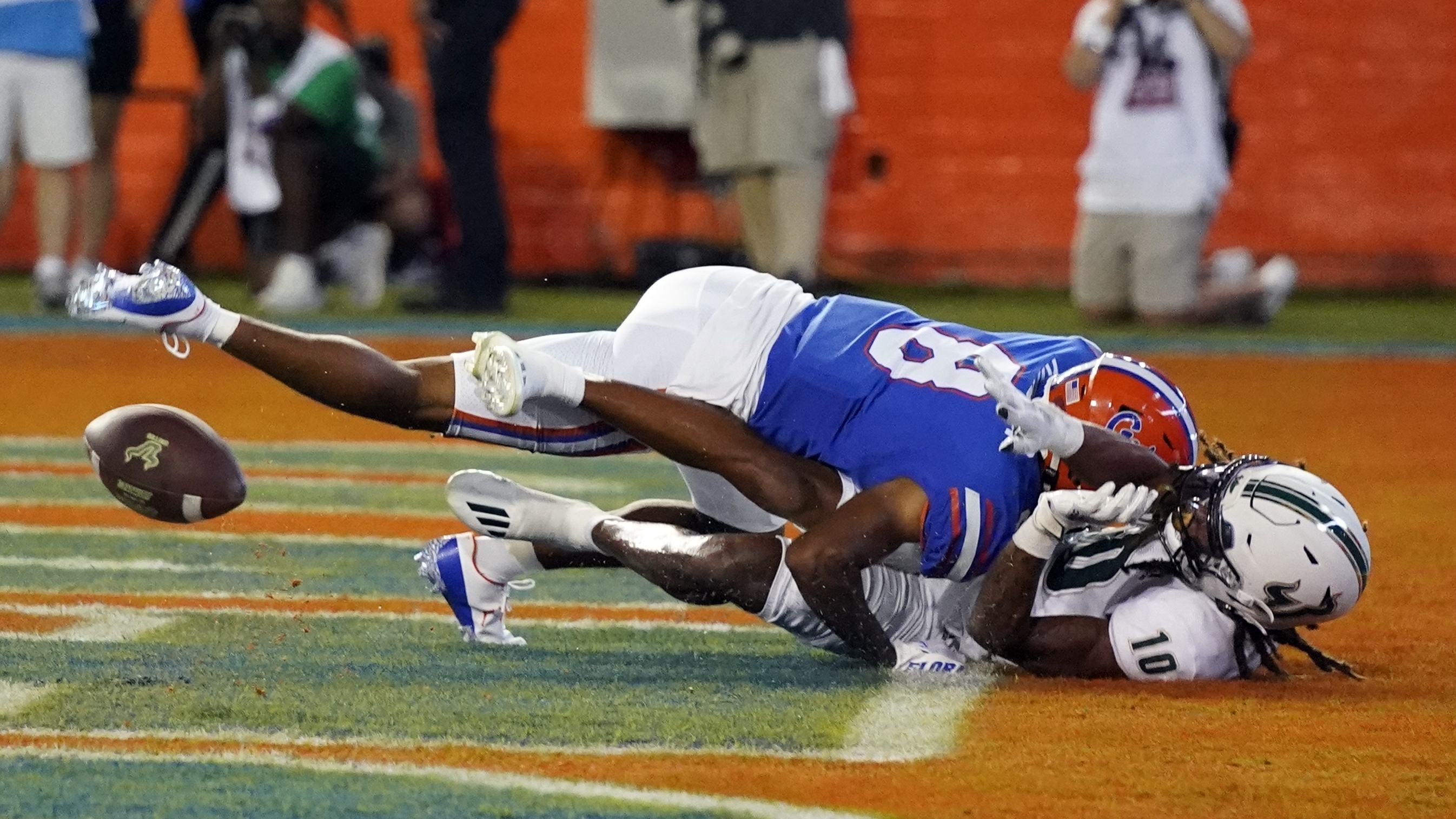 Florida cornerback Jalen Kimber, top left, breaks up a pass intended for South Florida wide receiver Xavier Weaver (10) during the first half of an NCAA college football game, Saturday, Sept. 17, 2022, in Gainesville, Fla. 
