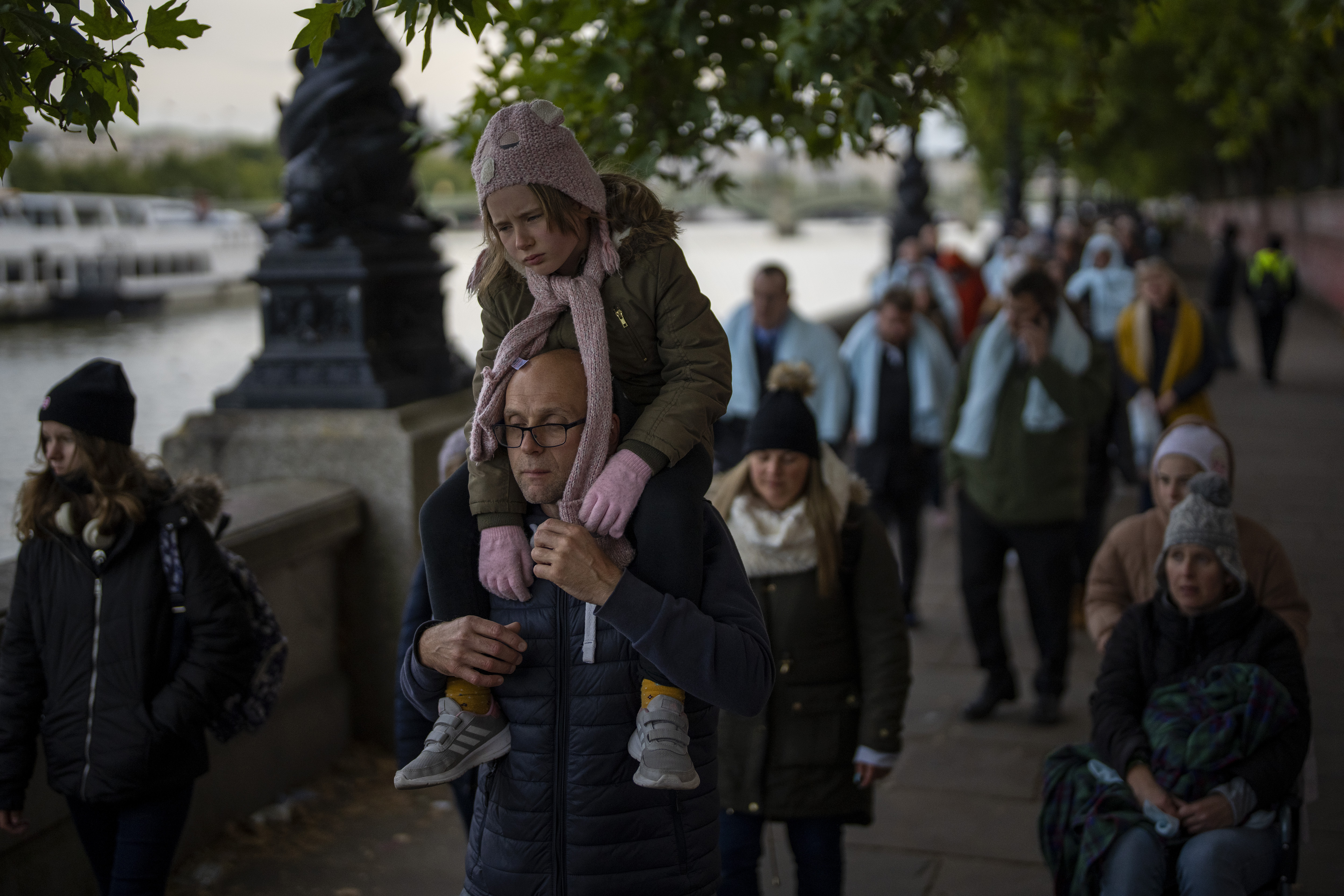 People queue to pay their respects to the late Queen Elizabeth II during the Lying-in State, outside Westminster Hall in London, Sunday.