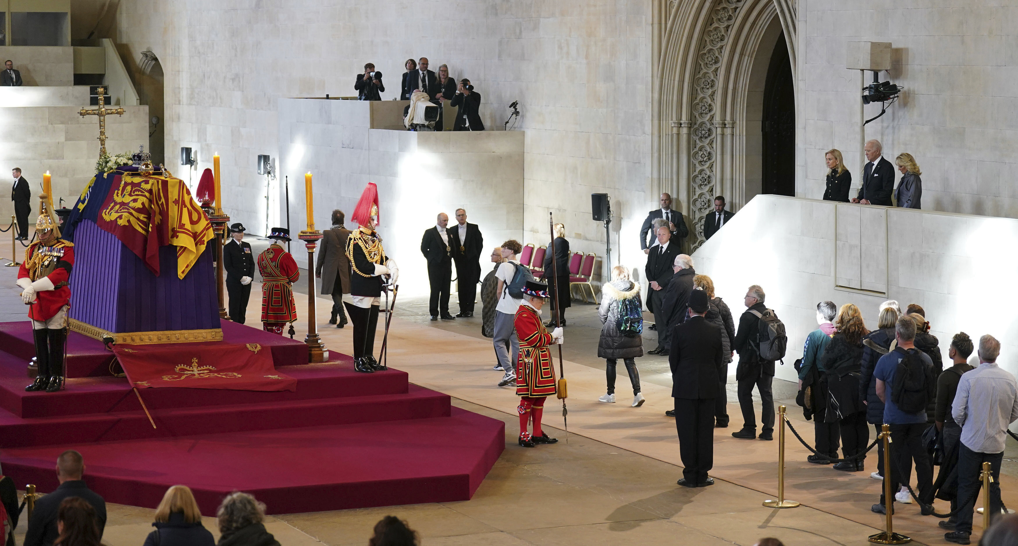 President Joe Biden and First Lady Jill Biden, far right, view the coffin of Queen Elizabeth II lying in state on the catafalque in Westminster Hall, at the Palace of Westminster, London, Sunday.