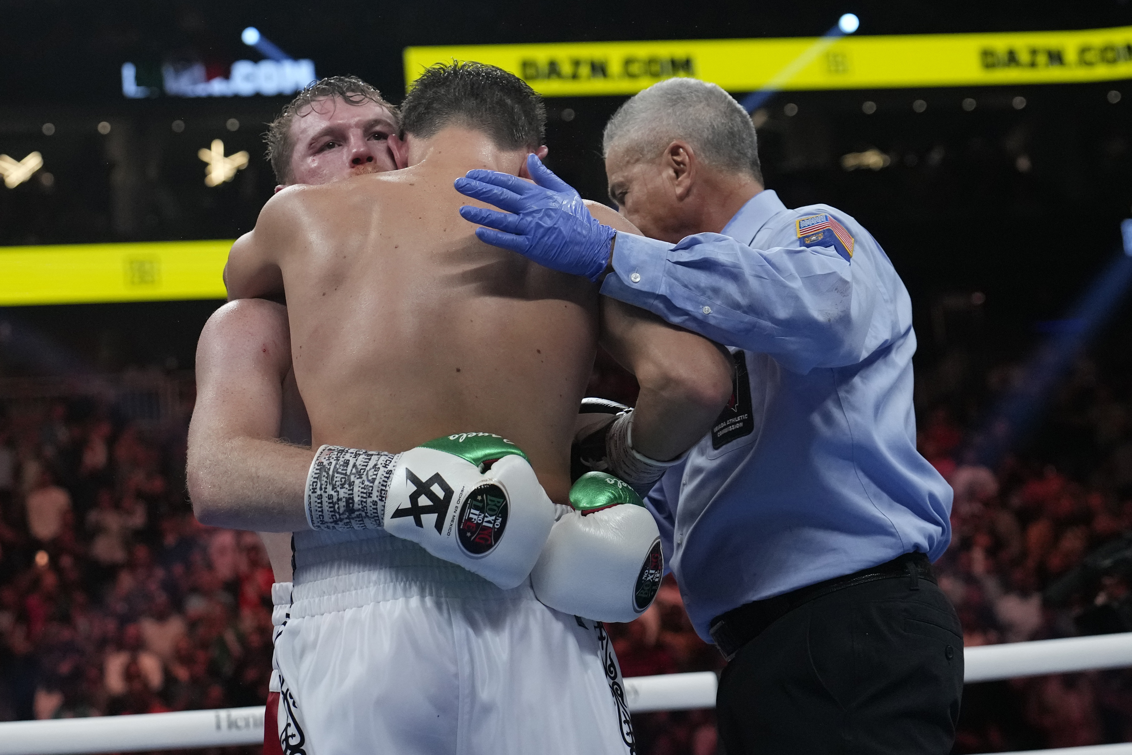 Canelo Alvarez, left, embraces Gennady Golovkin after defeating Golovkin in their super middleweight title boxing match, Saturday, Sept. 17, 2022, in Las Vegas. 