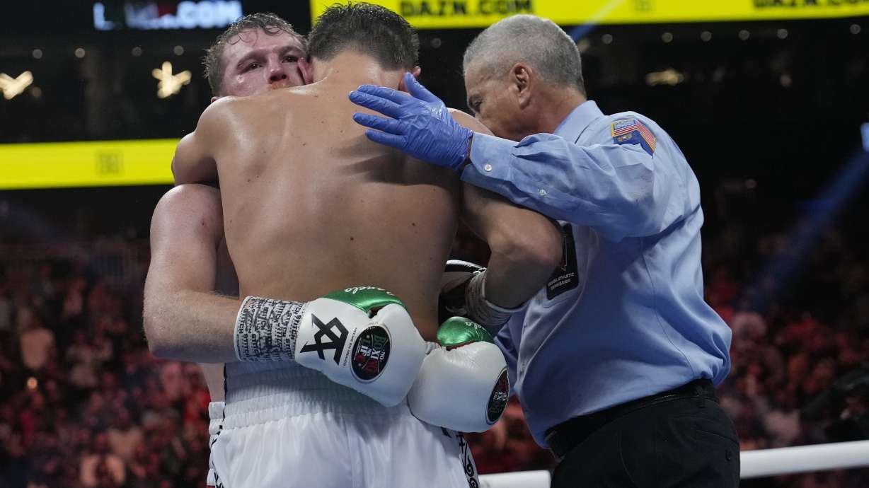 Canelo Alvarez, left, embraces Gennady Golovkin after defeating Golovkin in their super middleweight title boxing match, Saturday, Sept. 17, 2022, in Las Vegas.