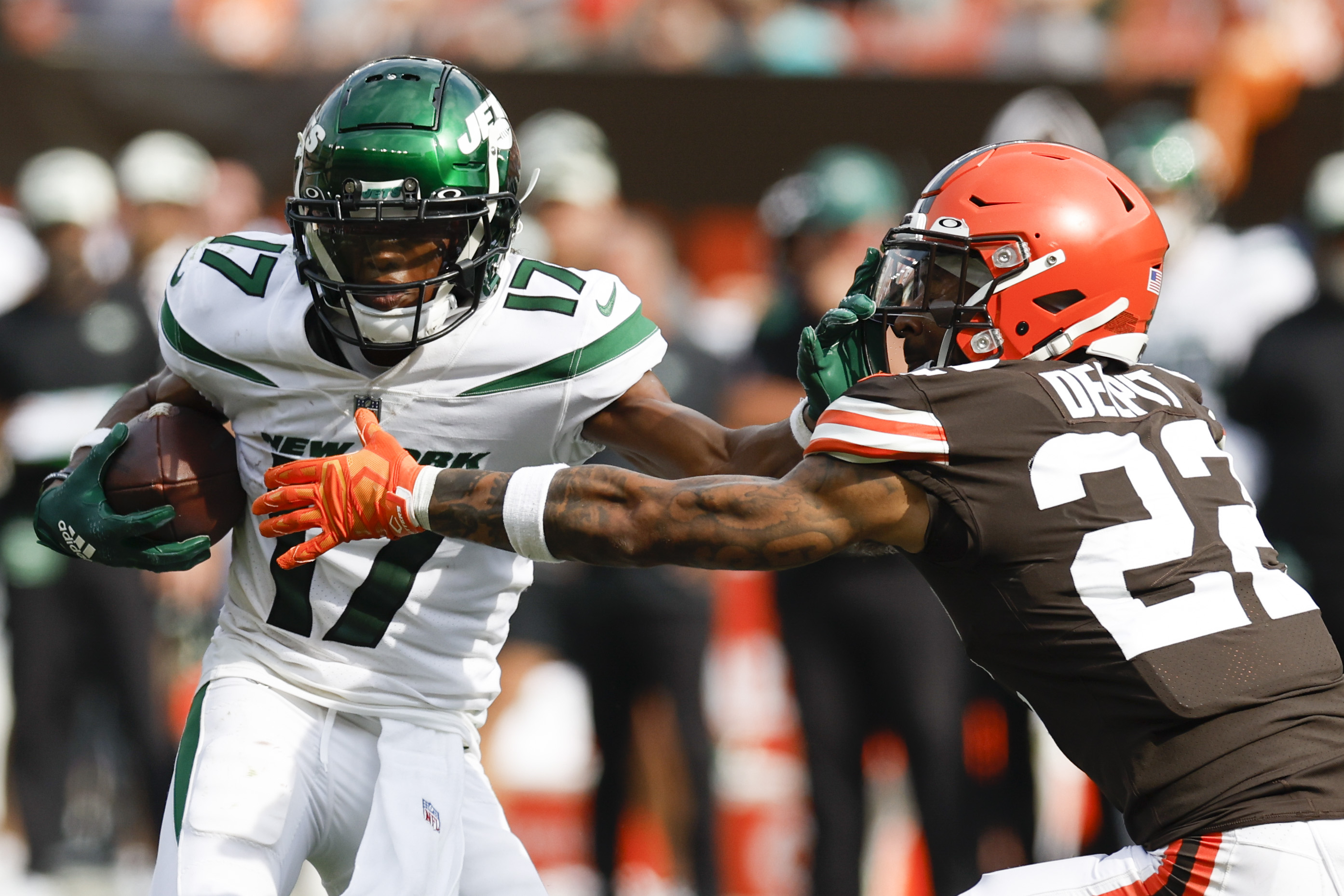 New York Jets wide receiver Garrett Wilson tries to break away from Cleveland Browns safety Grant Delpit (22) during the second half of an NFL football game, Sunday, Sept. 18, 2022, in Cleveland. The Jets won 31-30. 