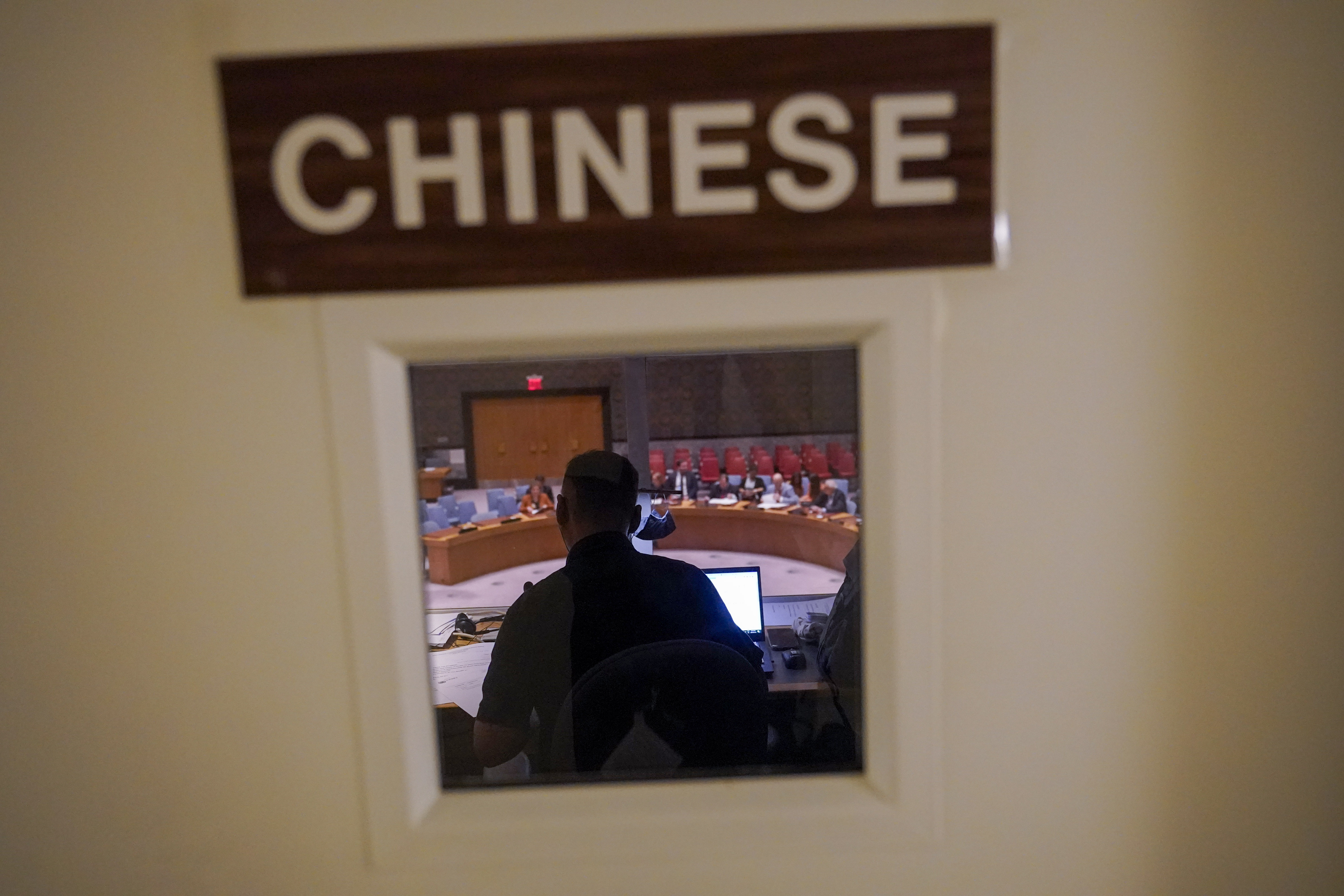 A Chinese translator works during a Security Council meeting at United Nations headquarters ahead of the General Assembly, Friday. As world leaders gather in New York at the annual U.N. General Assembly, rising superpower China is also focusing on another United Nations body that is meeting across the Atlantic Ocean in Geneva.  