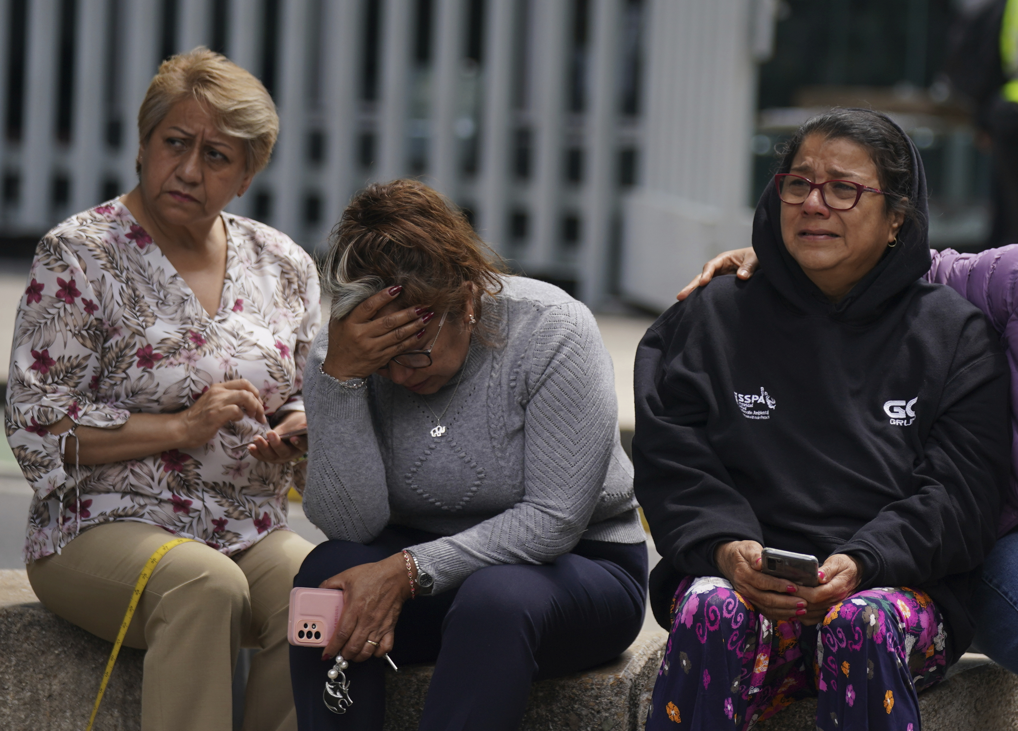 People gather outside after a magnitude 7.6 earthquake was felt in Mexico City on Monday. There were no immediate reports of damage from the quake that hit at 1:05 p.m. local time, according to the U.S. Geologic Survey.