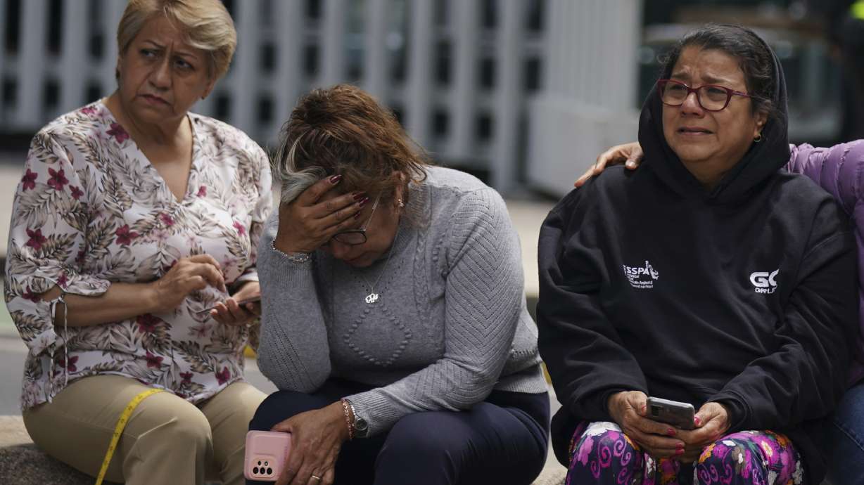 People gather outside after a magnitude 7.6 earthquake was felt in Mexico City on Monday. There were no immediate reports of damage from the quake that hit at 1:05 p.m. local time, according to the U.S. Geologic Survey.