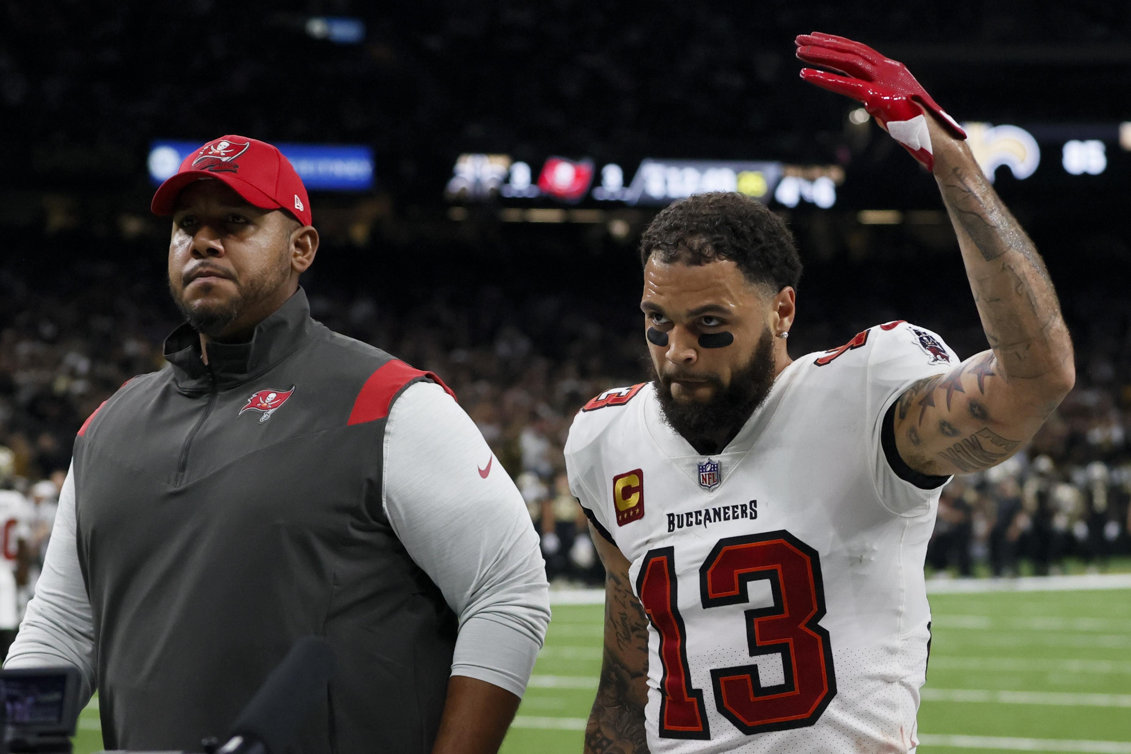 Tampa Bay Buccaneers wide receiver Mike Evans leaves the field after being thrown out of the game against the New Orleans Saints during the first half of an NFL football game in New Orleans, Sunday, Sept. 18, 2022. 