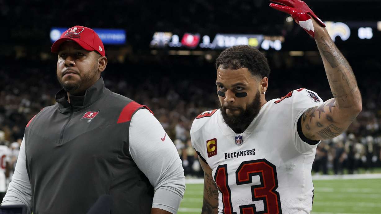 Tampa Bay Buccaneers wide receiver Mike Evans leaves the field after being thrown out of the game against the New Orleans Saints during the first half of an NFL football game in New Orleans, Sunday, Sept. 18, 2022.