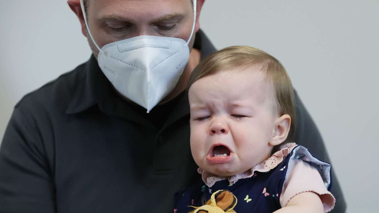 Lennox Rupp, 16 months, gets her COVID-19 vaccine as her father, Michael Rupp, holds her at the Salt Lake Public Health Center in Salt Lake City on June 21.