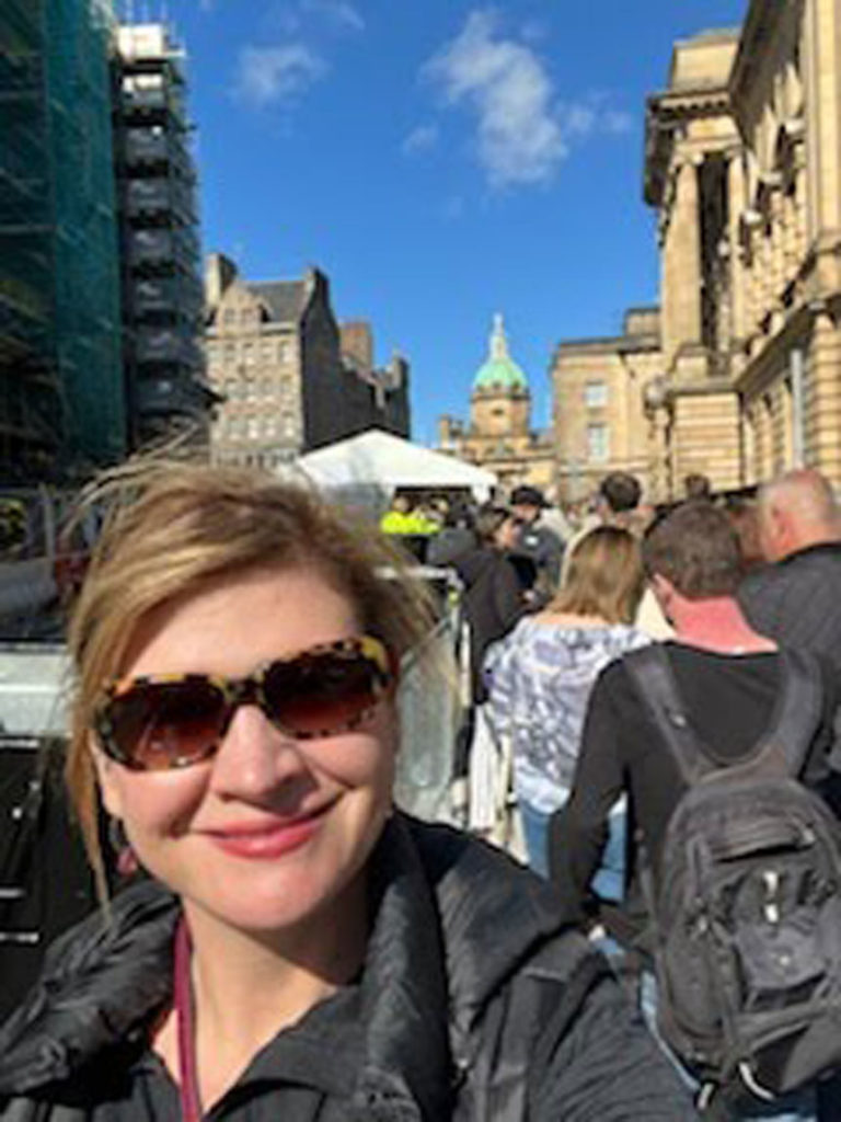 Luci Willits, an eastern Idaho native, waited in line recently to see the procession of the Queen and to see her laid at rest at St. Giles Cathedral.