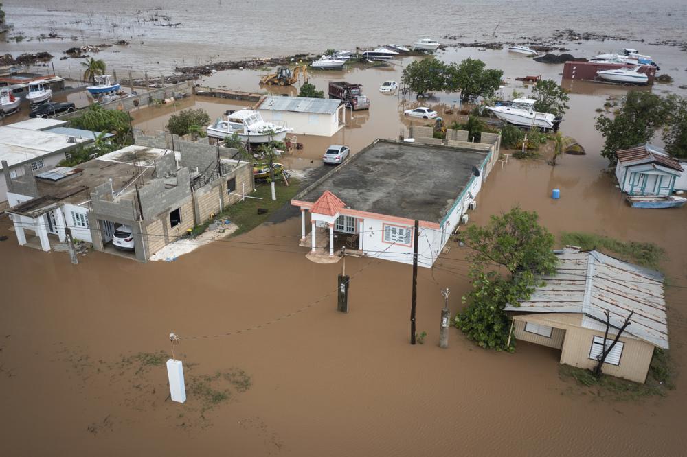 Homes are flooded on Salinas Beach after the passing of Hurricane Fiona in Salinas, Puerto Rico, Monday.