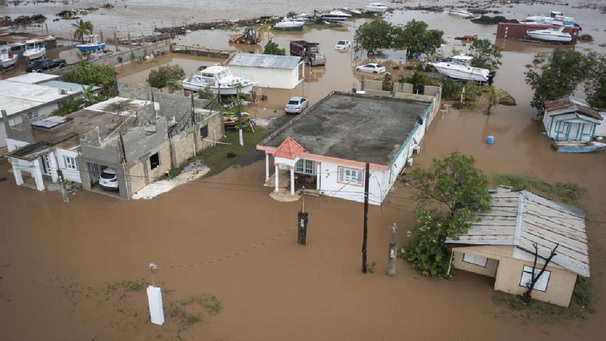 Homes are flooded on Salinas Beach after the passing of Hurricane Fiona in Salinas, Puerto Rico, Monday.