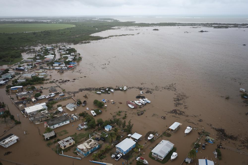 Homes are flooded on Salinas Beach after the passing of Hurricane Fiona in Salinas, Puerto Rico, Monday.