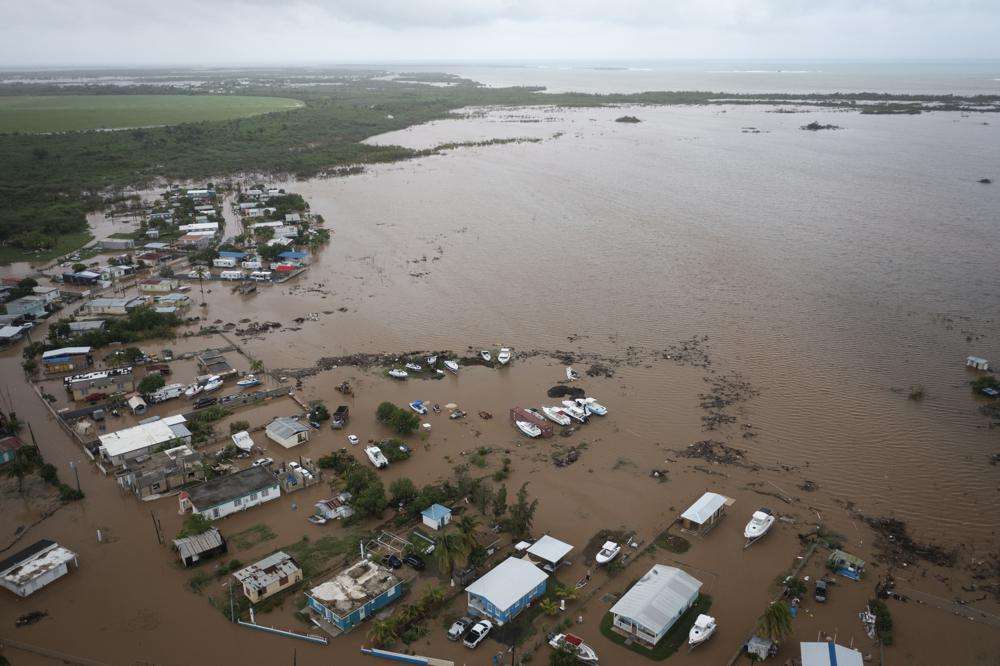 Homes are flooded on Salinas Beach after the passing of Hurricane Fiona in Salinas, Puerto Rico, Monday.