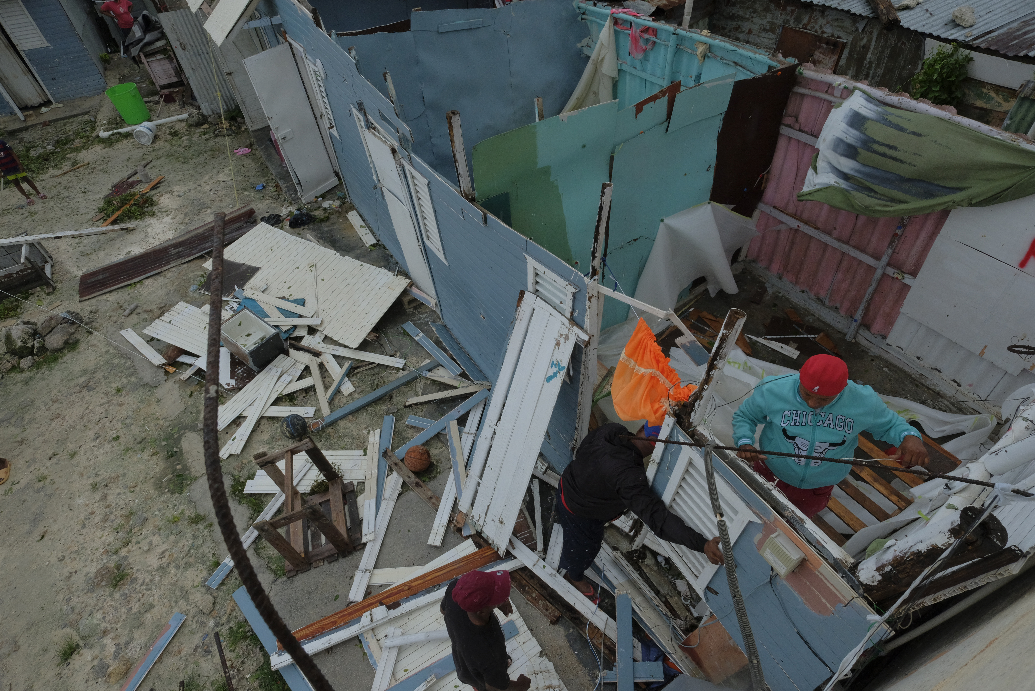 Residents replace a home's roof that was torn off by Hurricane Fiona in the low-income neighborhood of Kosovo in Veron de Punta Cana, Dominican Republic, Monday.