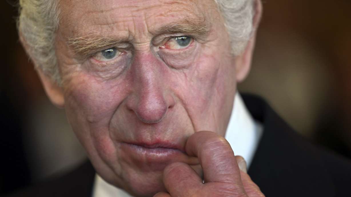Britain's King Charles III gestures during a visit to the Metropolitan Police Service Special Operations Room to thank Emergency Service workers for their work and support, ahead of the funeral of late Queen Elizabeth II, at the Lambeth headquarters in London, Saturday. King Charles III faces the task of preserving a 1,000-year-old monarchy that his mother nurtured for seven decades but that faces an uncertain future. The challenge is immense.