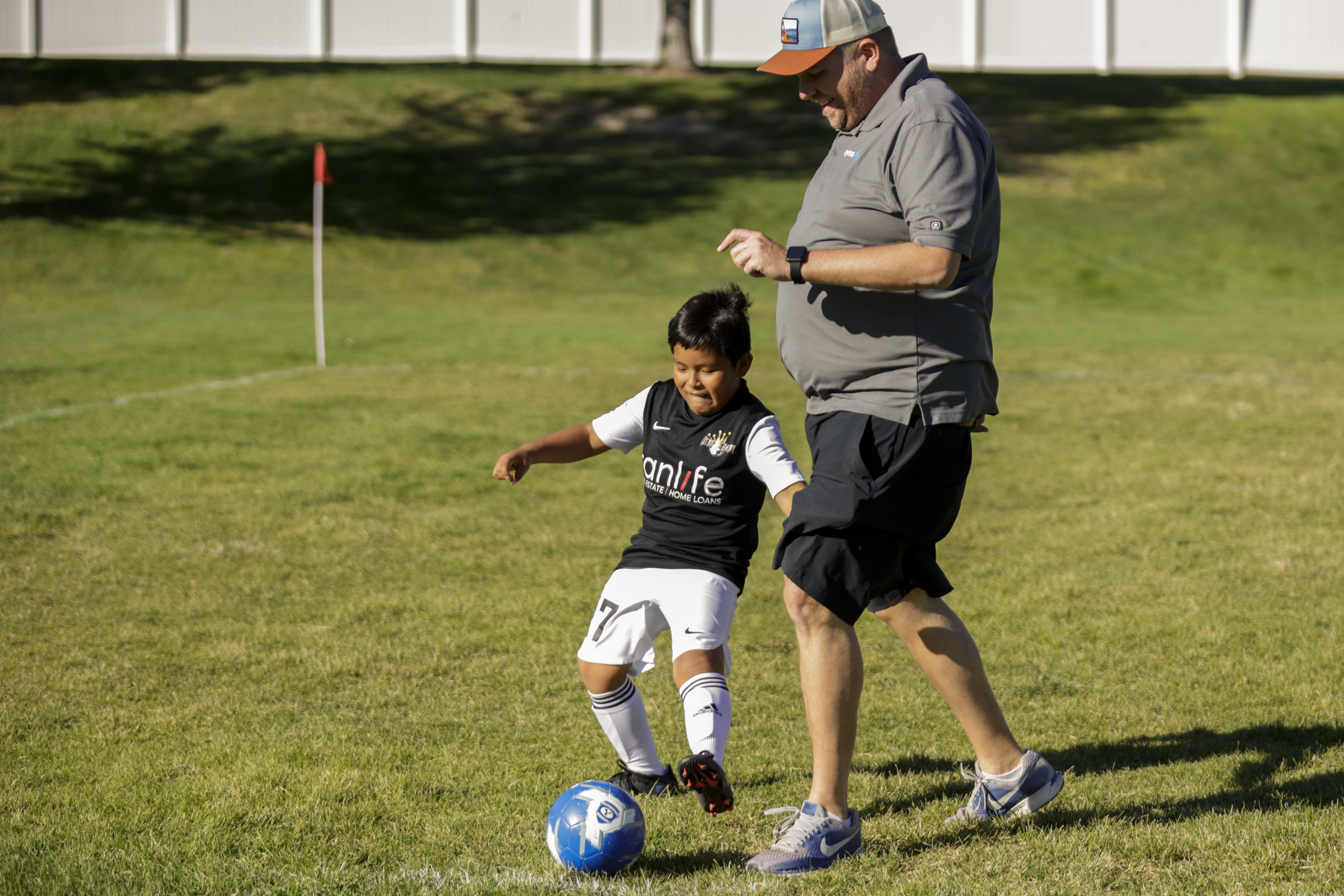 Steve Baret warms up with Kason Michels (7) of the Utah Glory before he plays the Cottonwood Football Club in South Jordan on Monday.