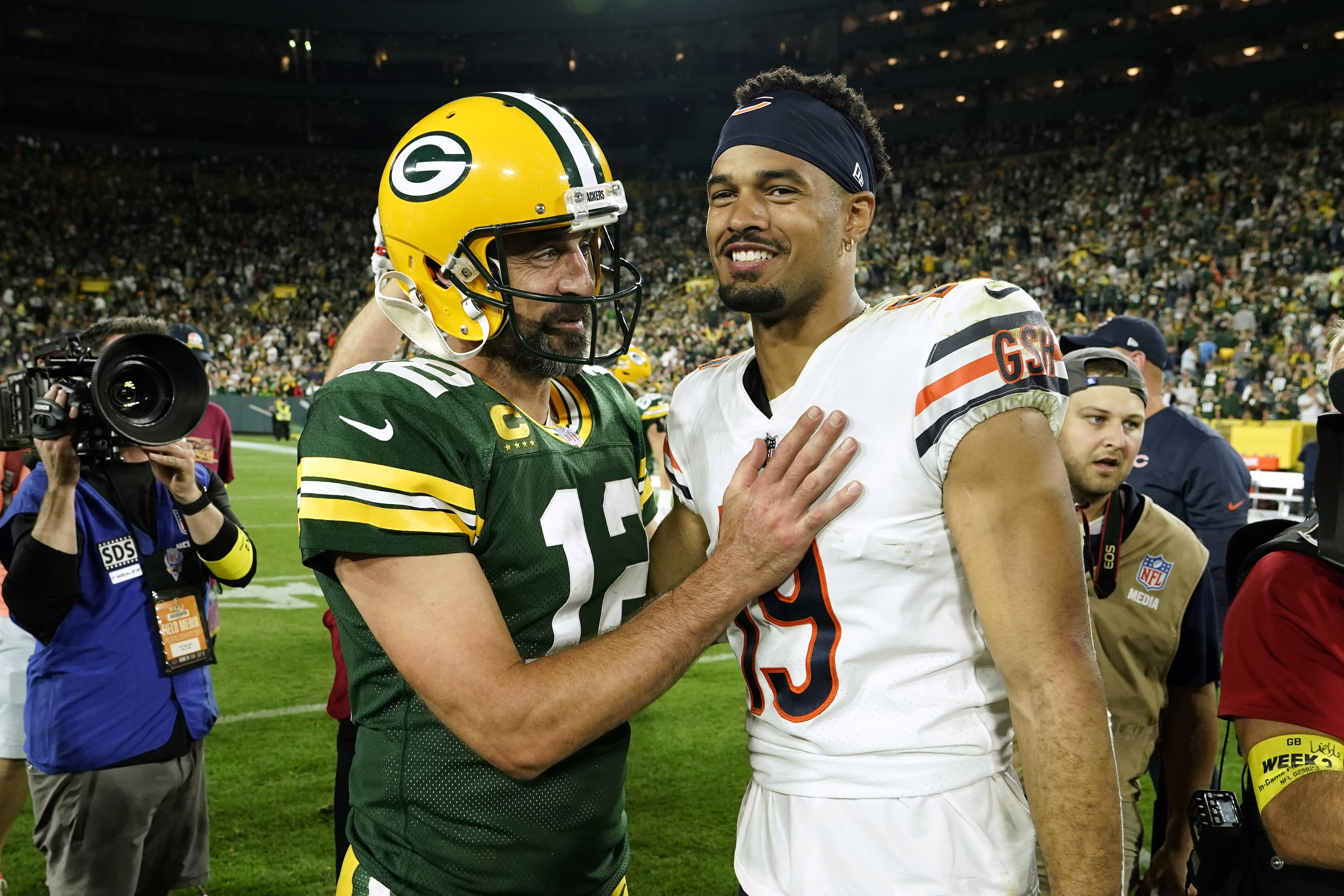 Green Bay Packers quarterback Aaron Rodgers (12) talks with Chicago Bears wide receiver Equanimeous St. Brown (19) after an NFL football game Sunday, Sept. 18, 2022, in Green Bay, Wis. The Packers won 27-10. 