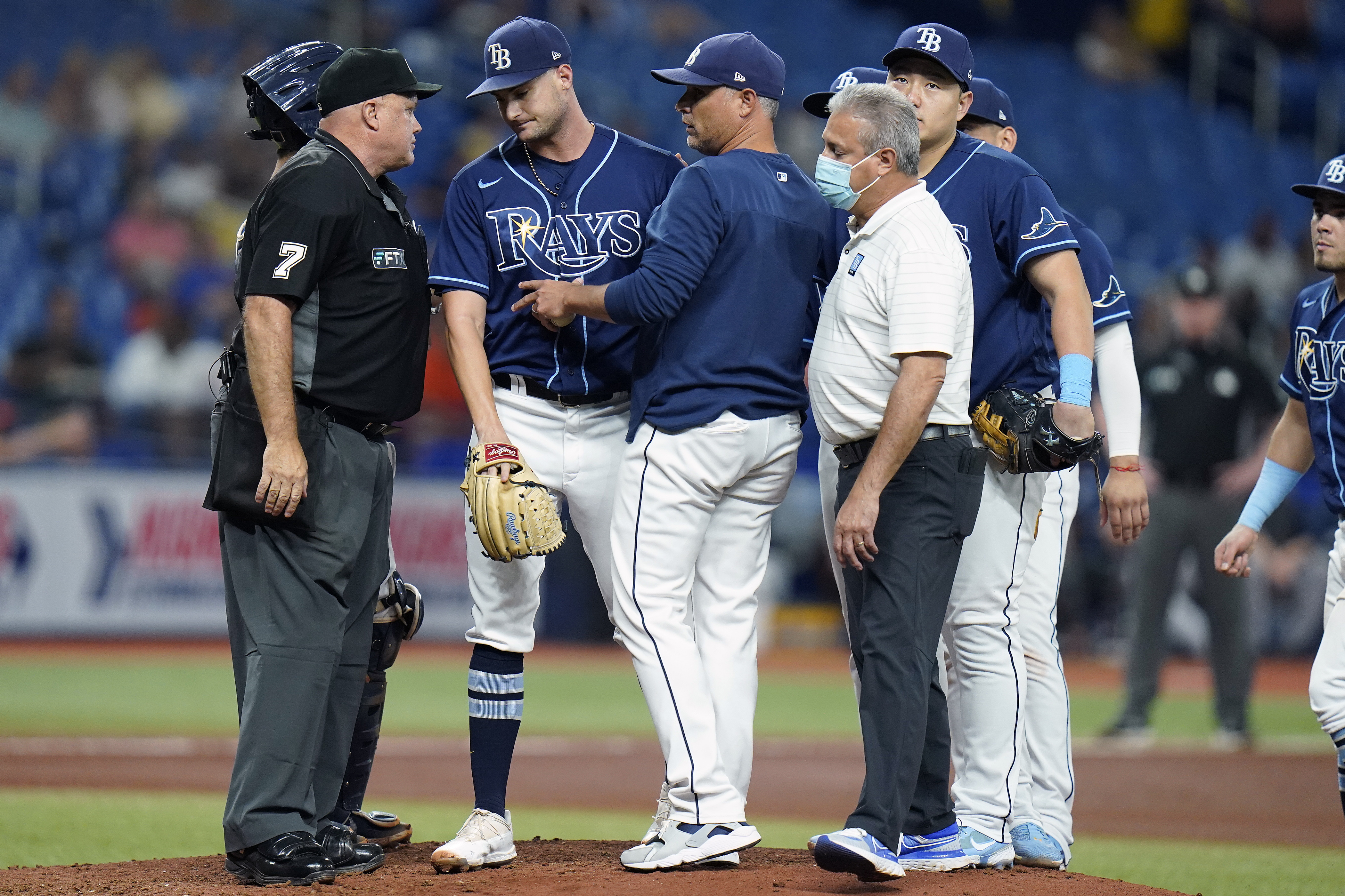 Tampa Bay Rays starting pitcher Shane McClanahan, second from left is taken out of the game against the Houston Astros during the fifth inning of a baseball game Tuesday, Sept. 20, 2022, in St. Petersburg, Fla. 