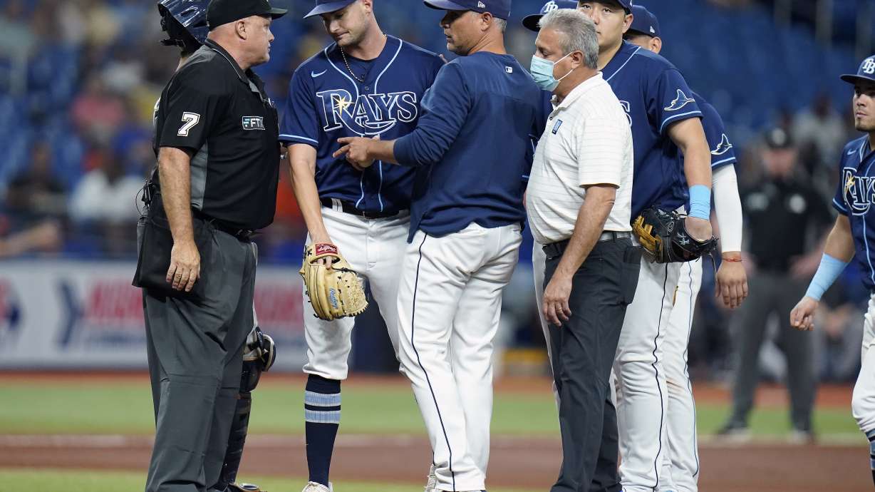 Tampa Bay Rays starting pitcher Shane McClanahan, second from left is taken out of the game against the Houston Astros during the fifth inning of a baseball game Tuesday, Sept. 20, 2022, in St. Petersburg, Fla.