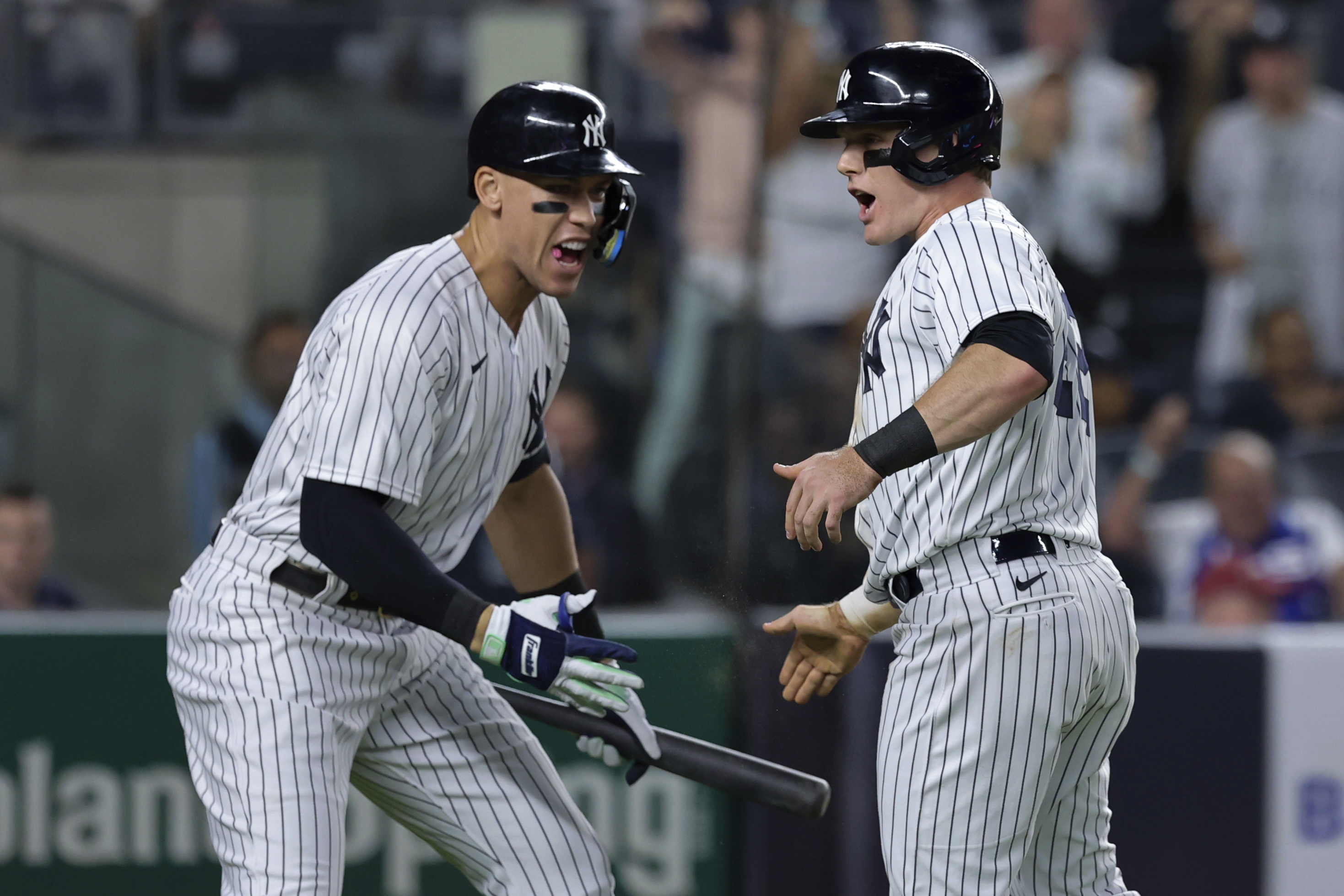 New York Yankees' Harrison Bader celebrates Aaron Judge after scoring against the Pittsburgh Pirates during the fifth inning of a baseball game Tuesday, Sept. 20, 2022, in New York. 